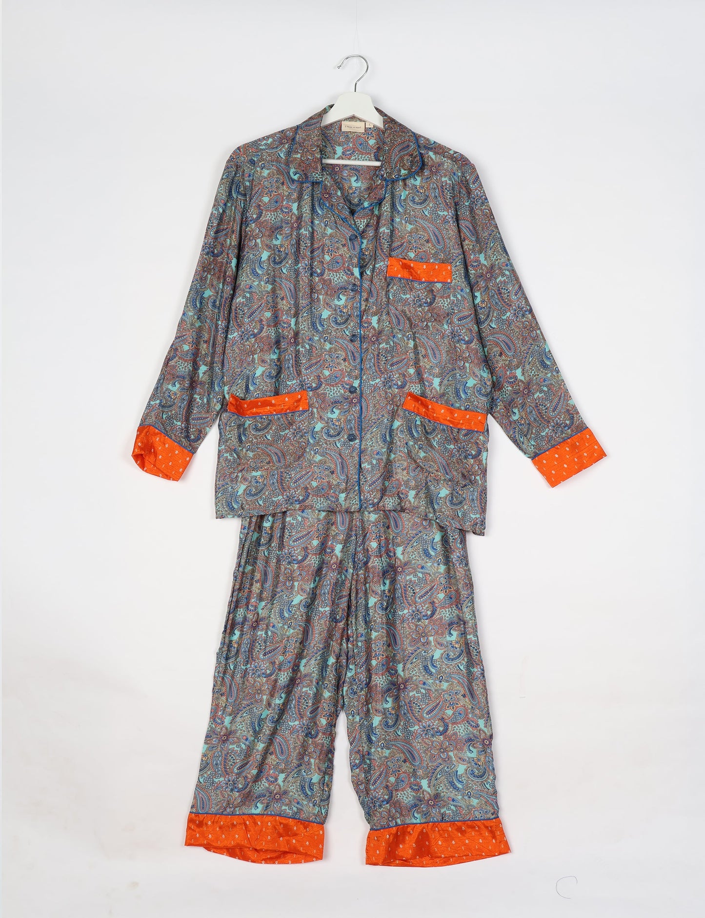 Chic long-sleeve pajama set made from recycled materials, representing eco friendly products, repurposed clothing, and zero waste clothing in green fashion.