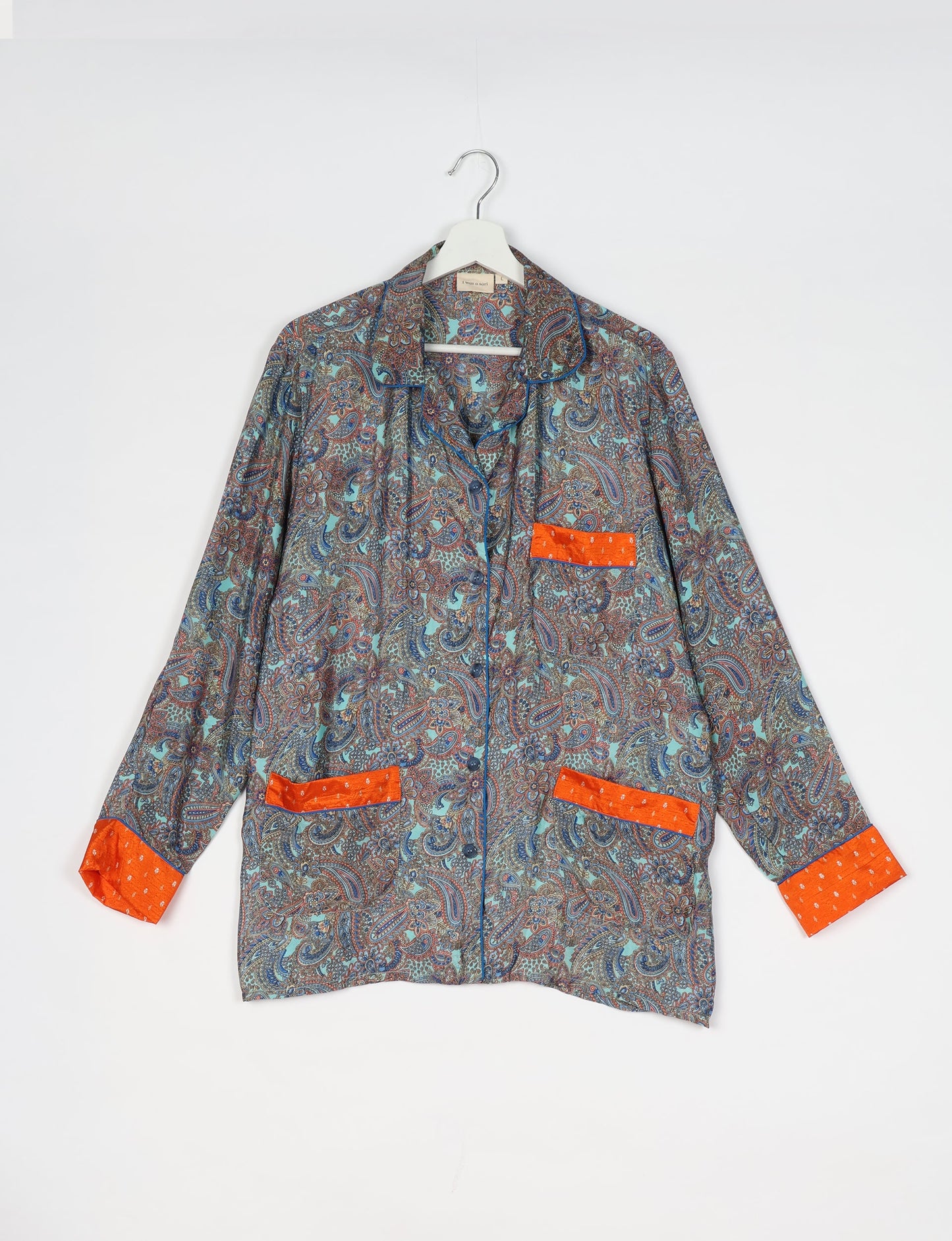 Chic long-sleeve pajama set made from recycled materials, representing eco friendly products, repurposed clothing, and zero waste clothing in green fashion.