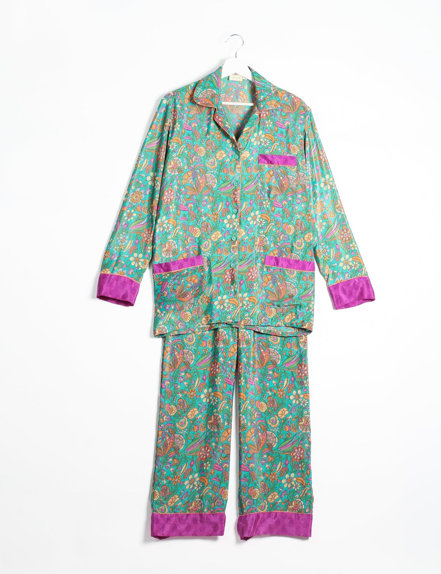 Choose sustainable sleepwear with our PJ SET – perfect for conscious living. From chilling to entertaining, these day-to-night pajamas feature an ethically crafted long-sleeve button-down and elastic-waist pants. Elevate your sleepwear with eco-friendly elegance.