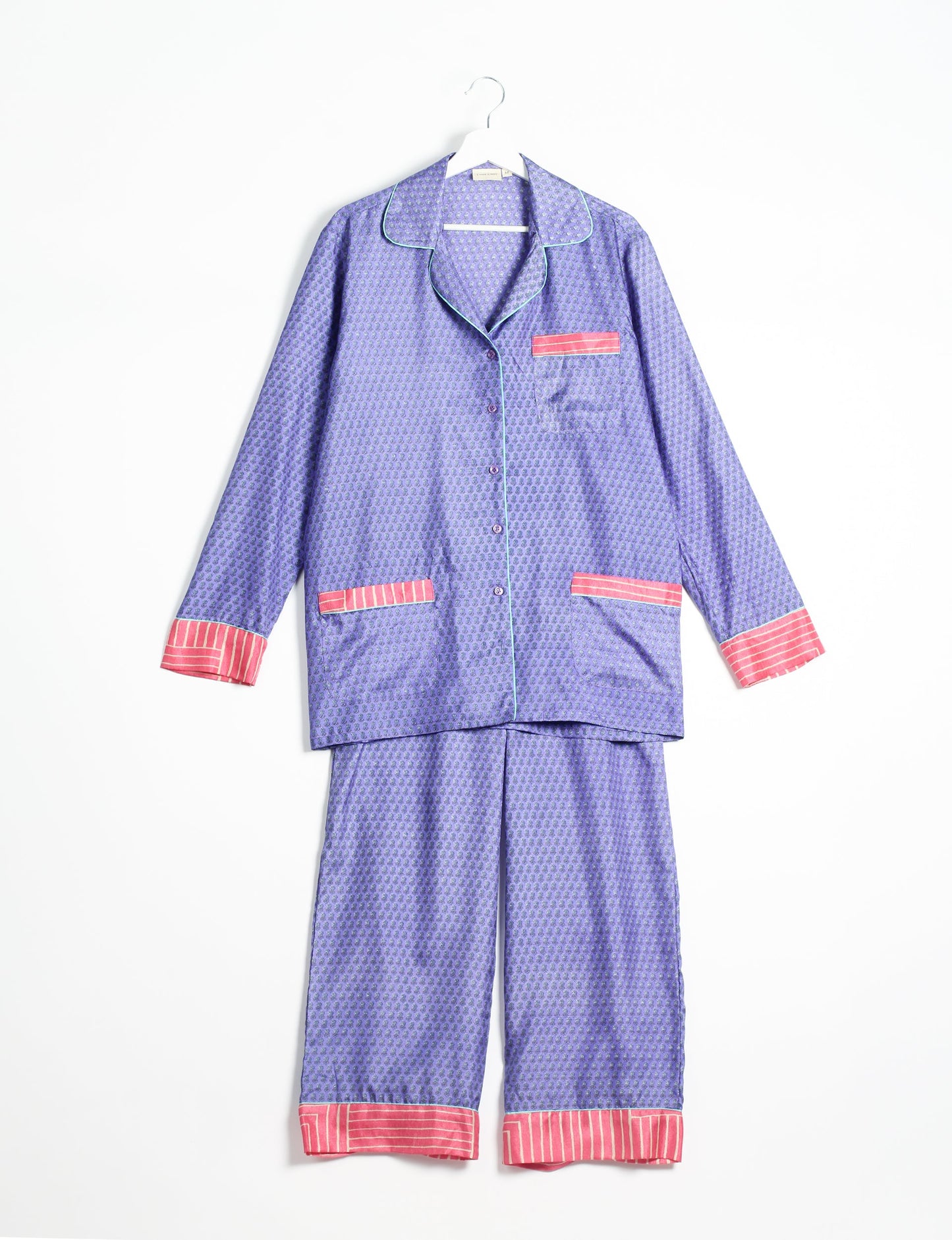 Choose sustainable sleepwear with our PJ SET – perfect for conscious living. From chilling to entertaining, these day-to-night pajamas feature an ethically crafted long-sleeve button-down and elastic-waist pants. Elevate your sleepwear with eco-friendly elegance.