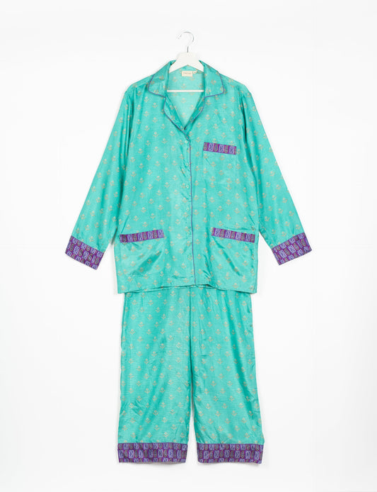 Choose sustainable sleepwear with our PJ SET – perfect for conscious living. From chilling to entertaining, these day-to-night pajamas feature an ethically crafted long-sleeve button-down and elastic-waist pants. Elevate your sleepwear with eco-friendly elegance.