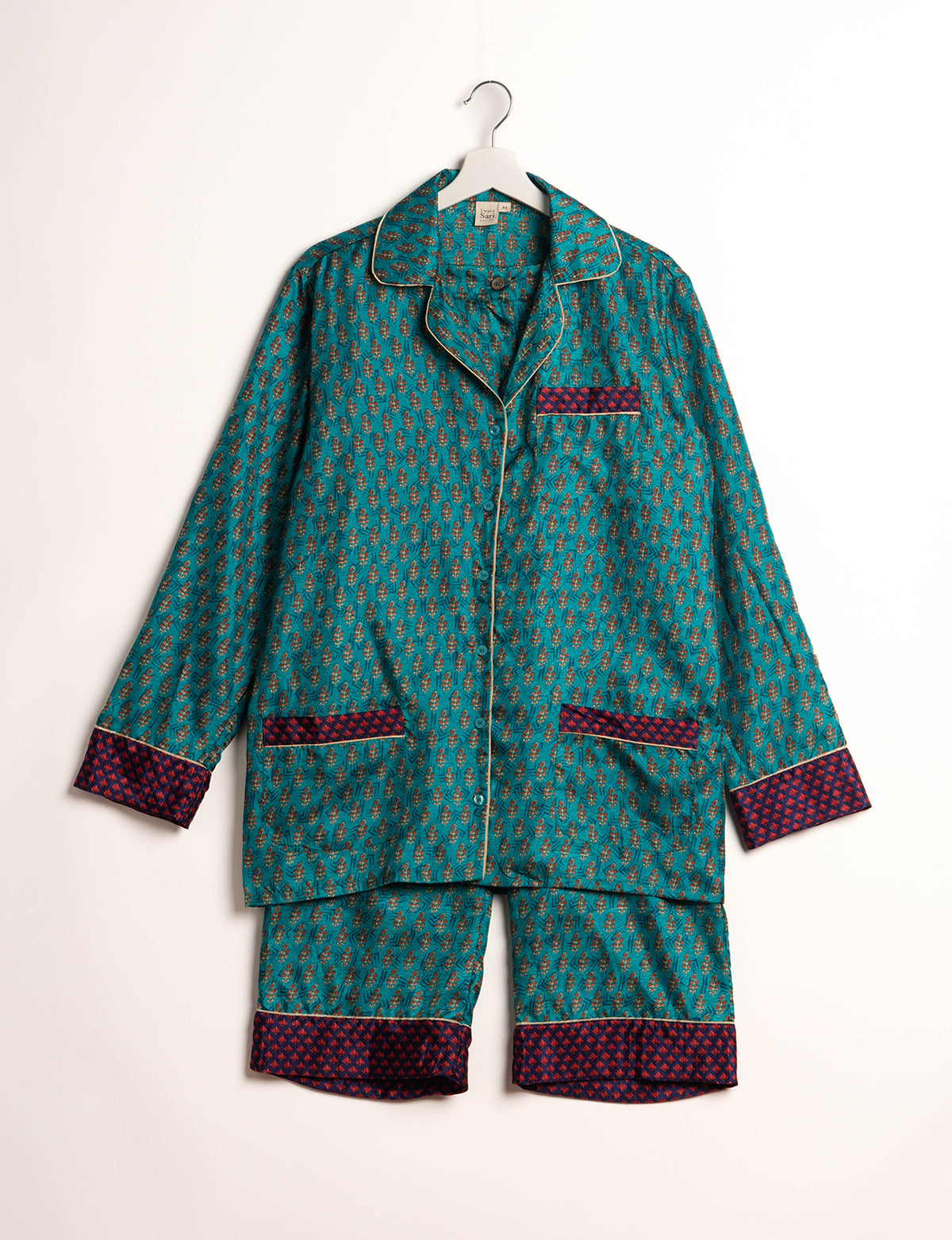 Choose sustainable sleepwear with our PJ SET – perfect for conscious living. From chilling to entertaining, these day-to-night pajamas feature an ethically crafted long-sleeve button-down and elastic-waist pants. Elevate your sleepwear with eco-friendly elegance.