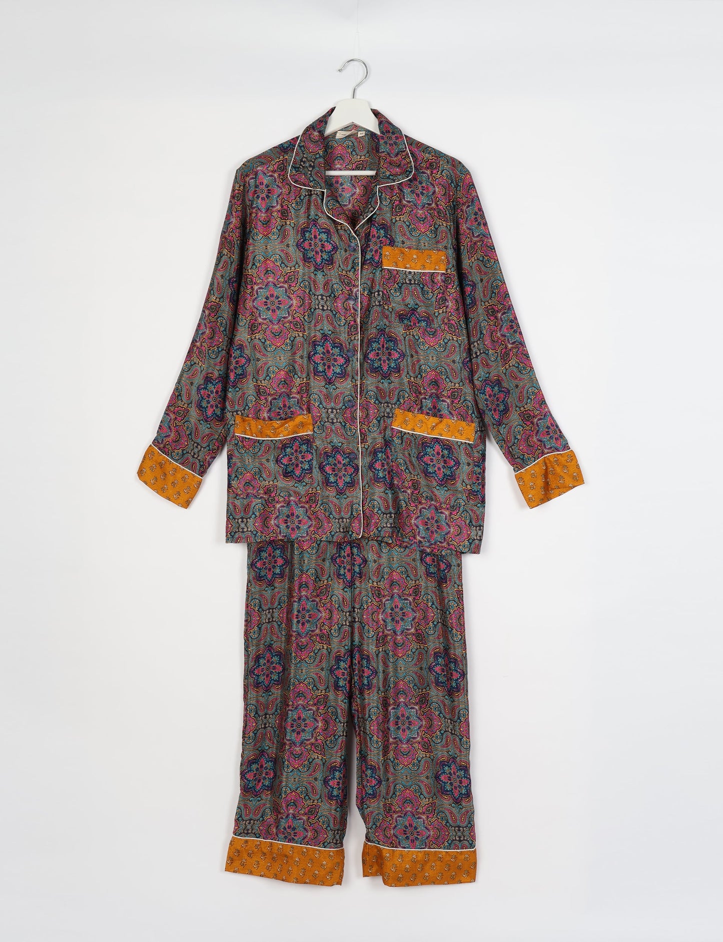 Chic long-sleeve pajama set made from recycled materials, representing eco friendly products, repurposed clothing, and zero waste clothing in green fashion.