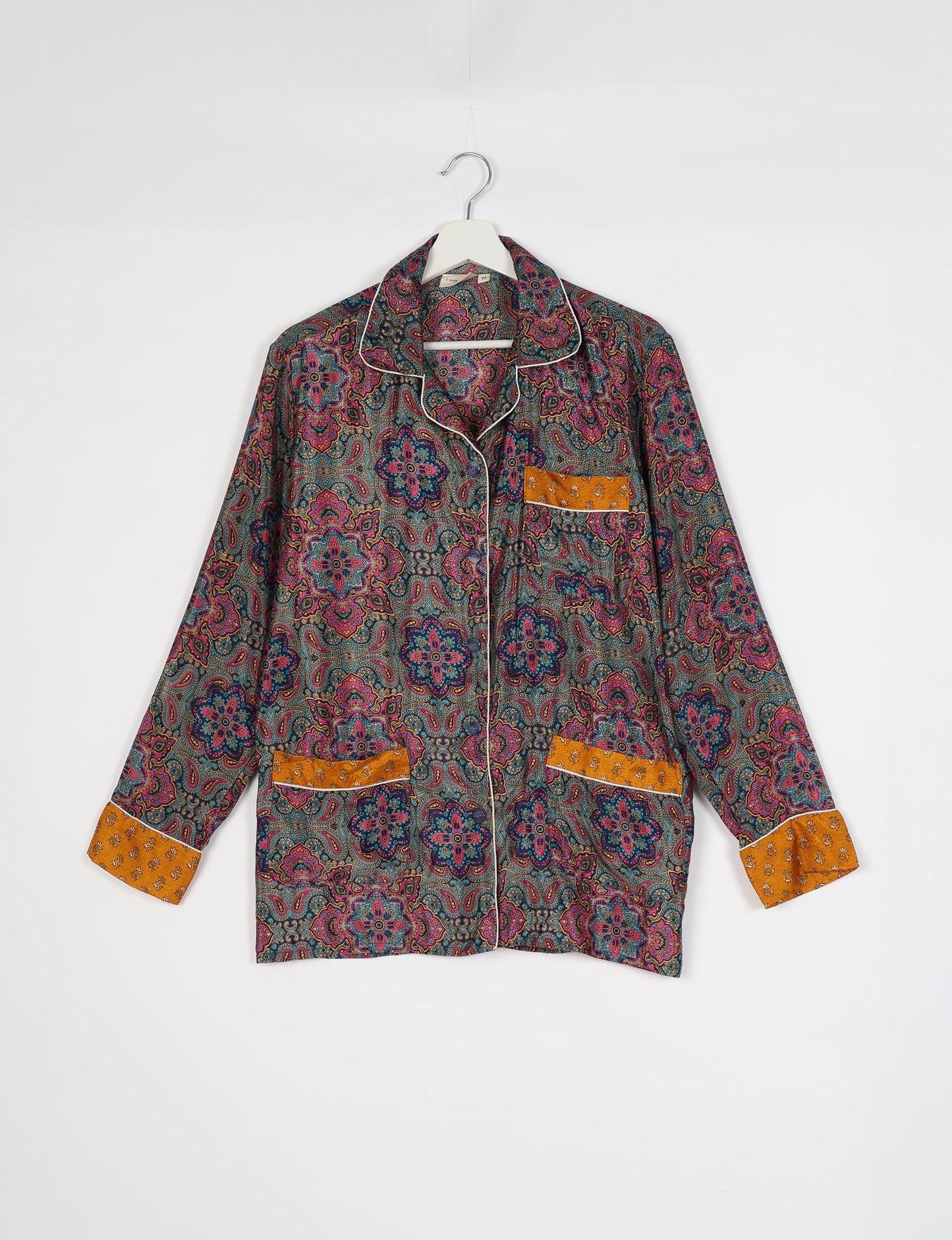 Chic long-sleeve pajama set made from recycled materials, representing eco friendly products, repurposed clothing, and zero waste clothing in green fashion.