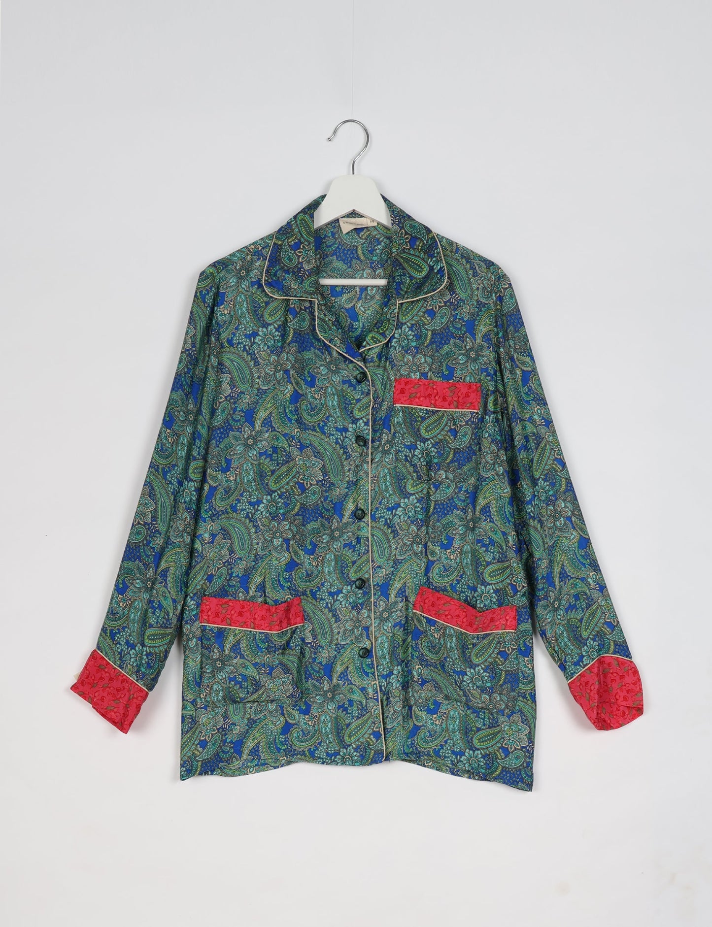 Chic long-sleeve pajama set made from recycled materials, representing eco friendly products, repurposed clothing, and zero waste clothing in green fashion.