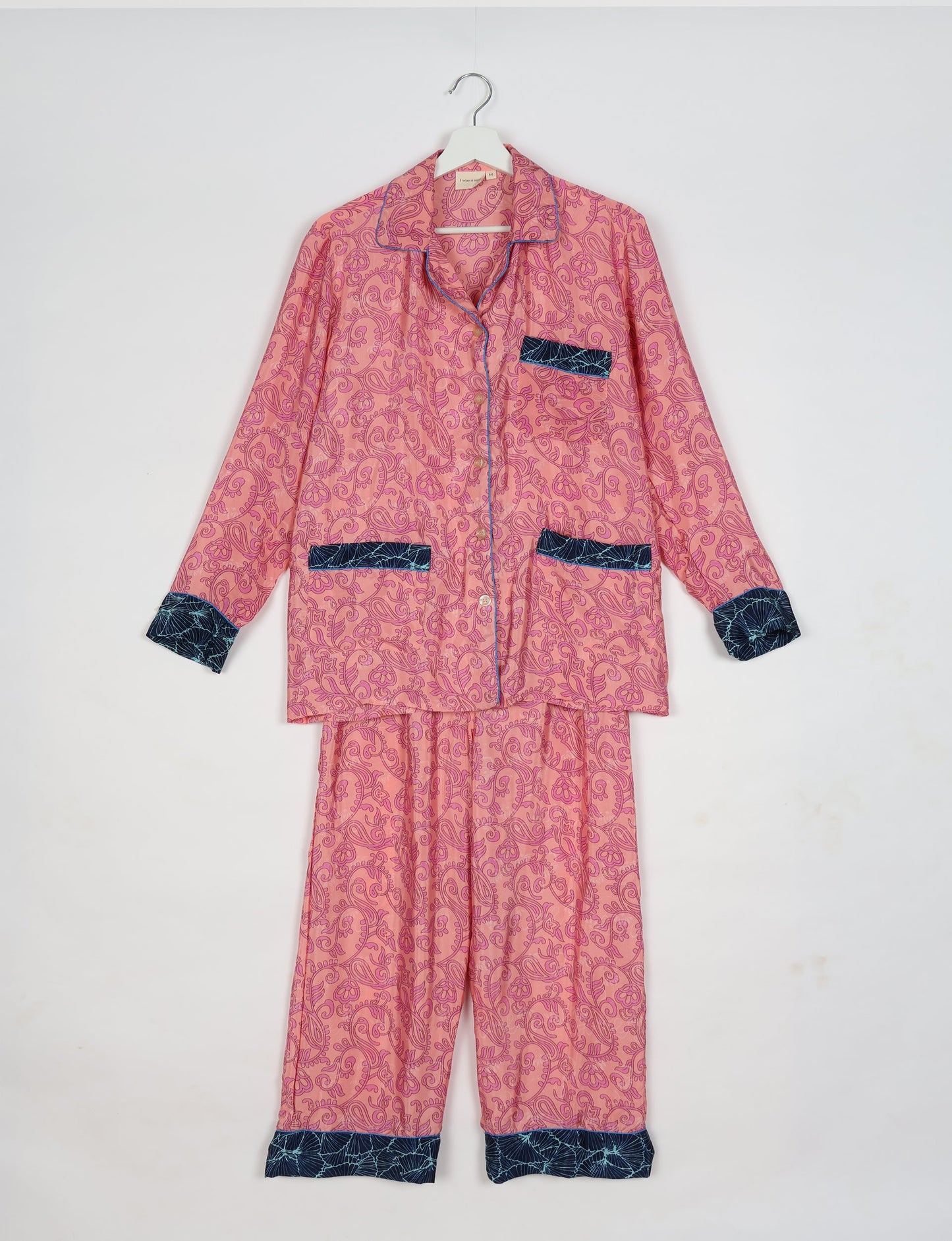 Chic long-sleeve pajama set made from recycled materials, representing eco friendly products, repurposed clothing, and zero waste clothing in green fashion.