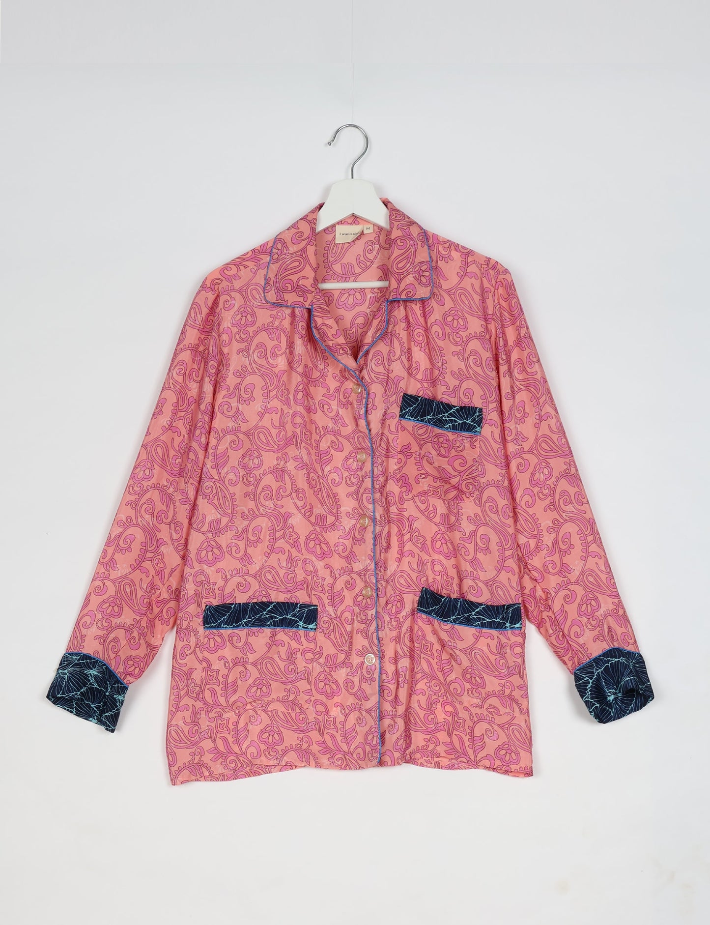 Chic long-sleeve pajama set made from recycled materials, representing eco friendly products, repurposed clothing, and zero waste clothing in green fashion.