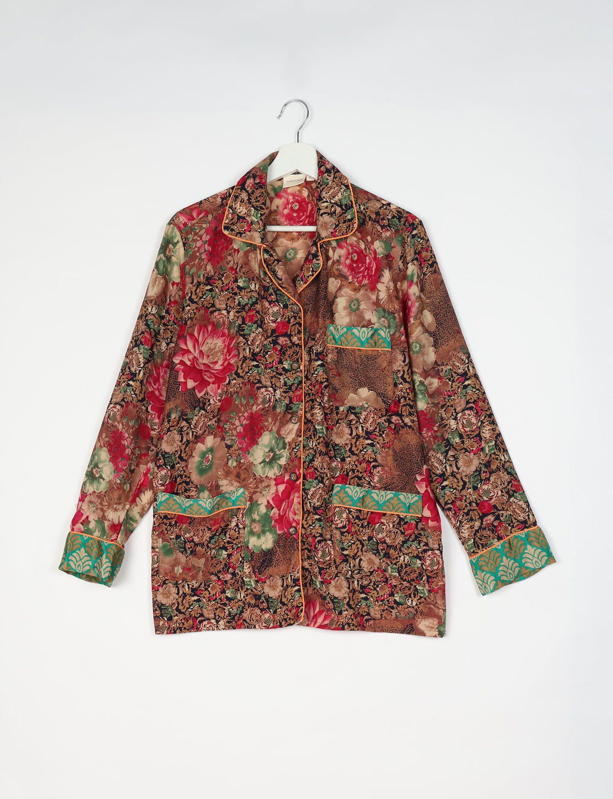 Chic long-sleeve pajama set made from recycled materials, representing eco friendly products, repurposed clothing, and zero waste clothing in green fashion.