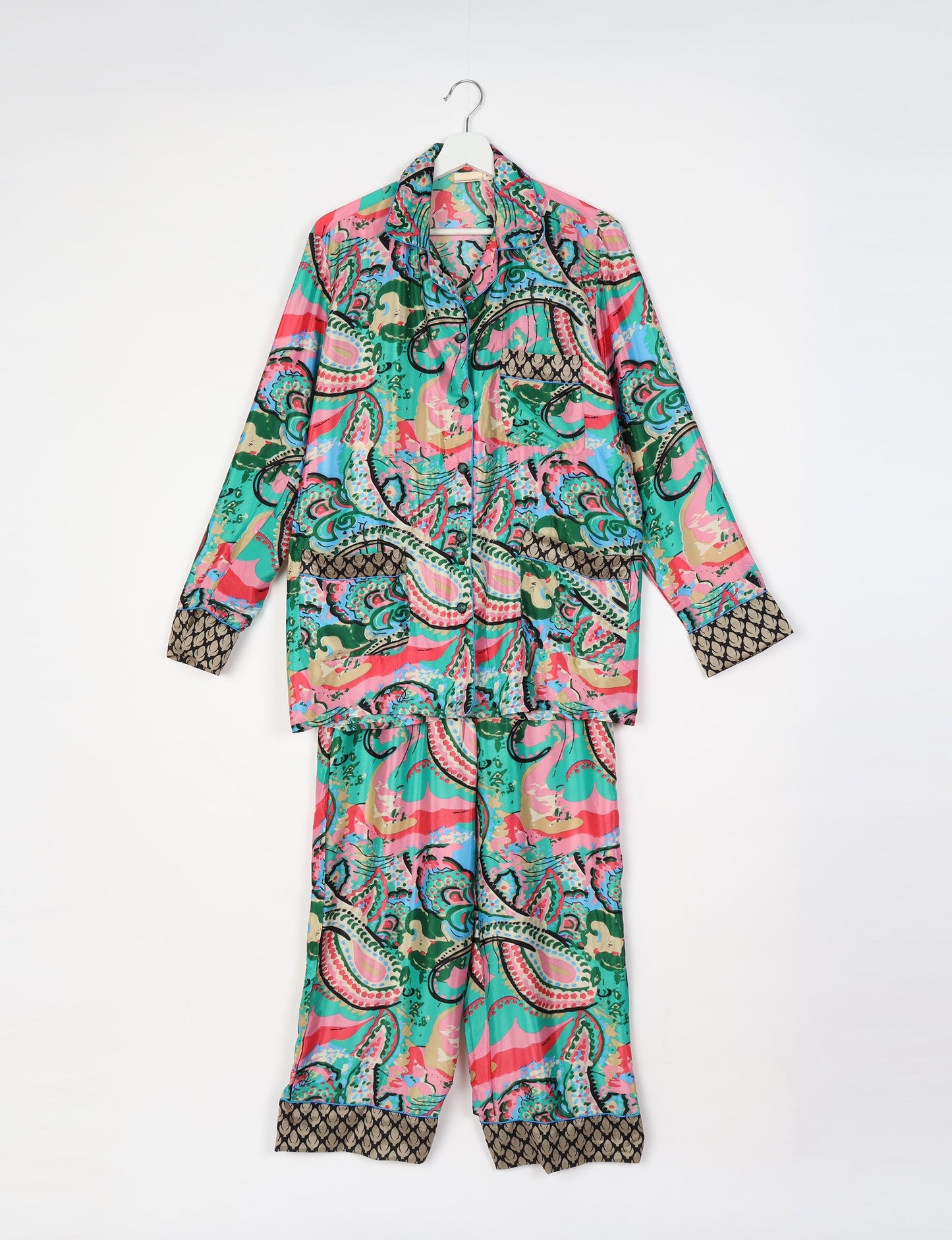 Chic long-sleeve pajama set made from recycled materials, representing eco friendly products, repurposed clothing, and zero waste clothing in green fashion.