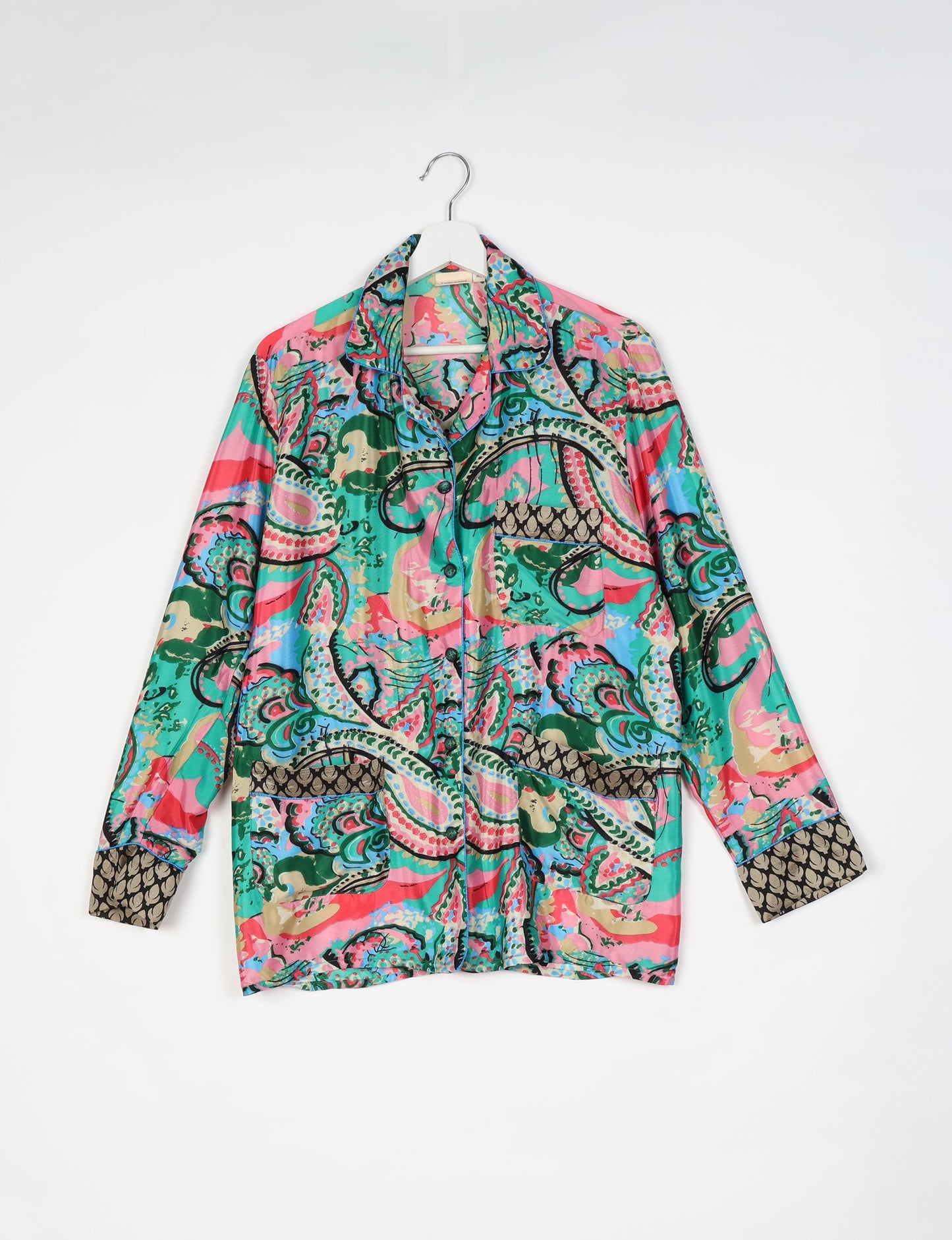 Chic long-sleeve pajama set made from recycled materials, representing eco friendly products, repurposed clothing, and zero waste clothing in green fashion.