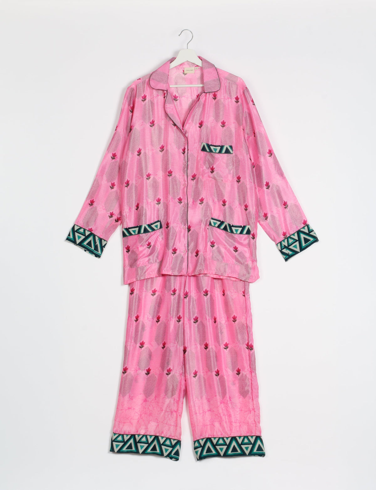 Choose sustainable sleepwear with our PJ SET – perfect for conscious living. From chilling to entertaining, these day-to-night pajamas feature an ethically crafted long-sleeve button-down and elastic-waist pants. Elevate your sleepwear with eco-friendly elegance.