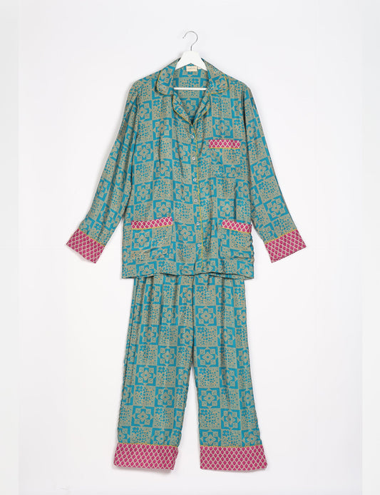 Choose sustainable sleepwear with our PJ SET – perfect for conscious living. From chilling to entertaining, these day-to-night pajamas feature an ethically crafted long-sleeve button-down and elastic-waist pants. Elevate your sleepwear with eco-friendly elegance.