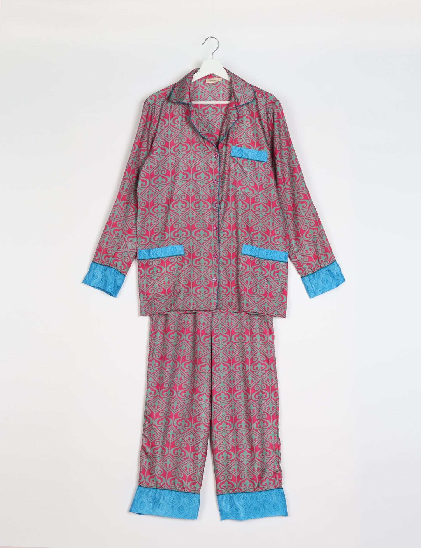 Choose sustainable sleepwear with our PJ SET – perfect for conscious living. From chilling to entertaining, these day-to-night pajamas feature an ethically crafted long-sleeve button-down and elastic-waist pants. Elevate your sleepwear with eco-friendly elegance.