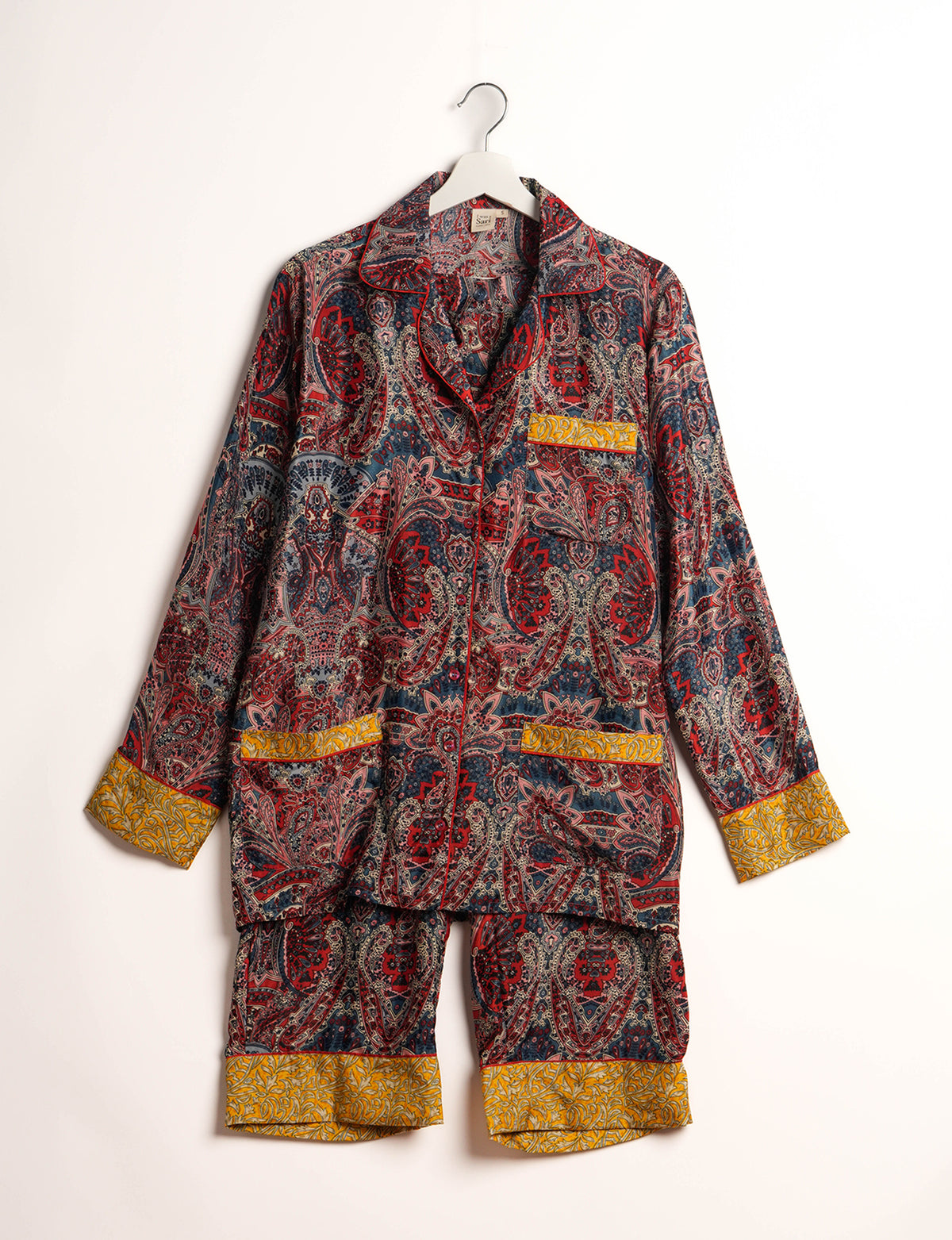 Choose sustainable sleepwear with our PJ SET – perfect for conscious living. From chilling to entertaining, these day-to-night pajamas feature an ethically crafted long-sleeve button-down and elastic-waist pants. Elevate your sleepwear with eco-friendly elegance.