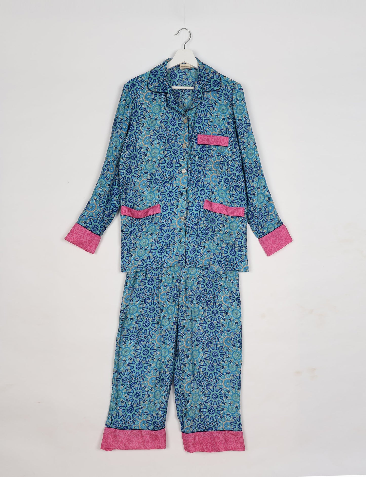 Chic long-sleeve pajama set made from recycled materials, representing eco friendly products, repurposed clothing, and zero waste clothing in green fashion.