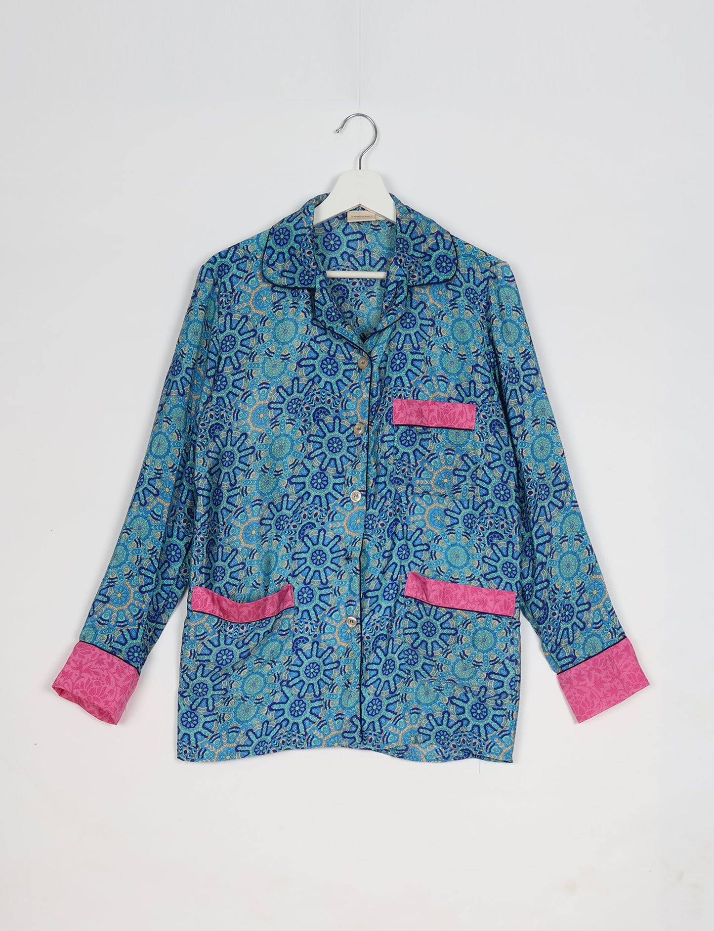 Chic long-sleeve pajama set made from recycled materials, representing eco friendly products, repurposed clothing, and zero waste clothing in green fashion.