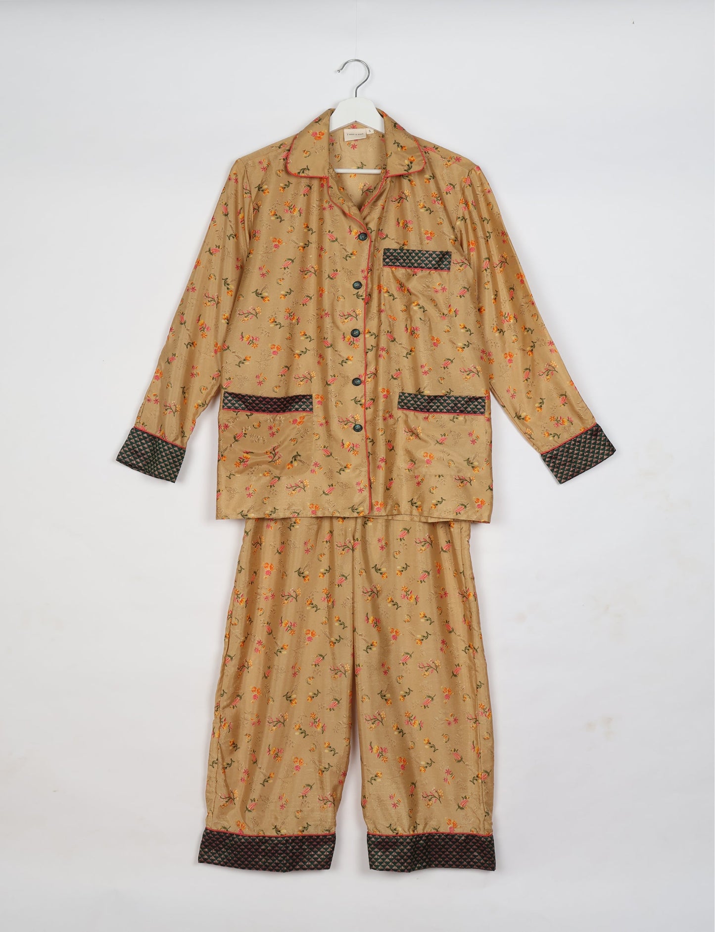 Chic long-sleeve pajama set made from recycled materials, representing eco friendly products, repurposed clothing, and zero waste clothing in green fashion.