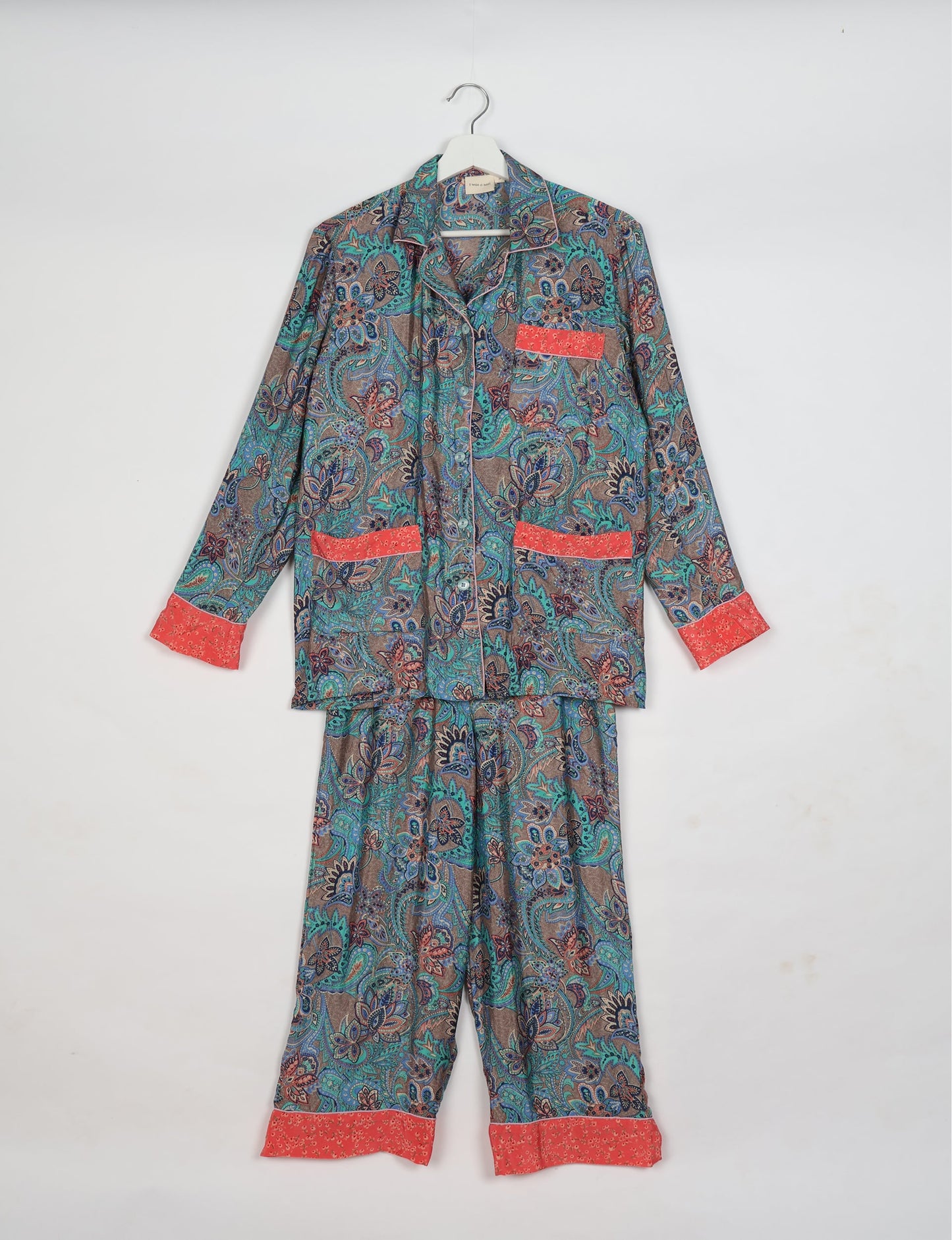 Chic long-sleeve pajama set made from recycled materials, representing eco friendly products, repurposed clothing, and zero waste clothing in green fashion.