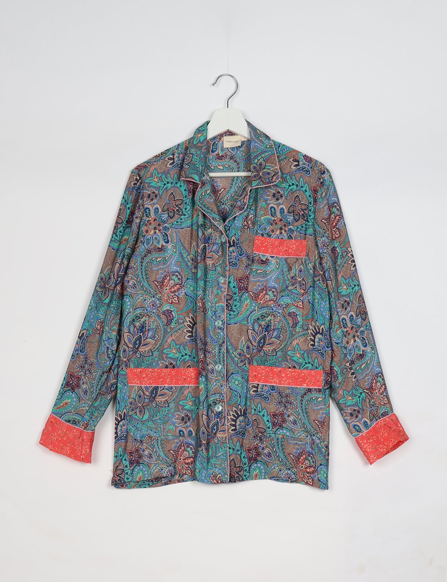 Chic long-sleeve pajama set made from recycled materials, representing eco friendly products, repurposed clothing, and zero waste clothing in green fashion.