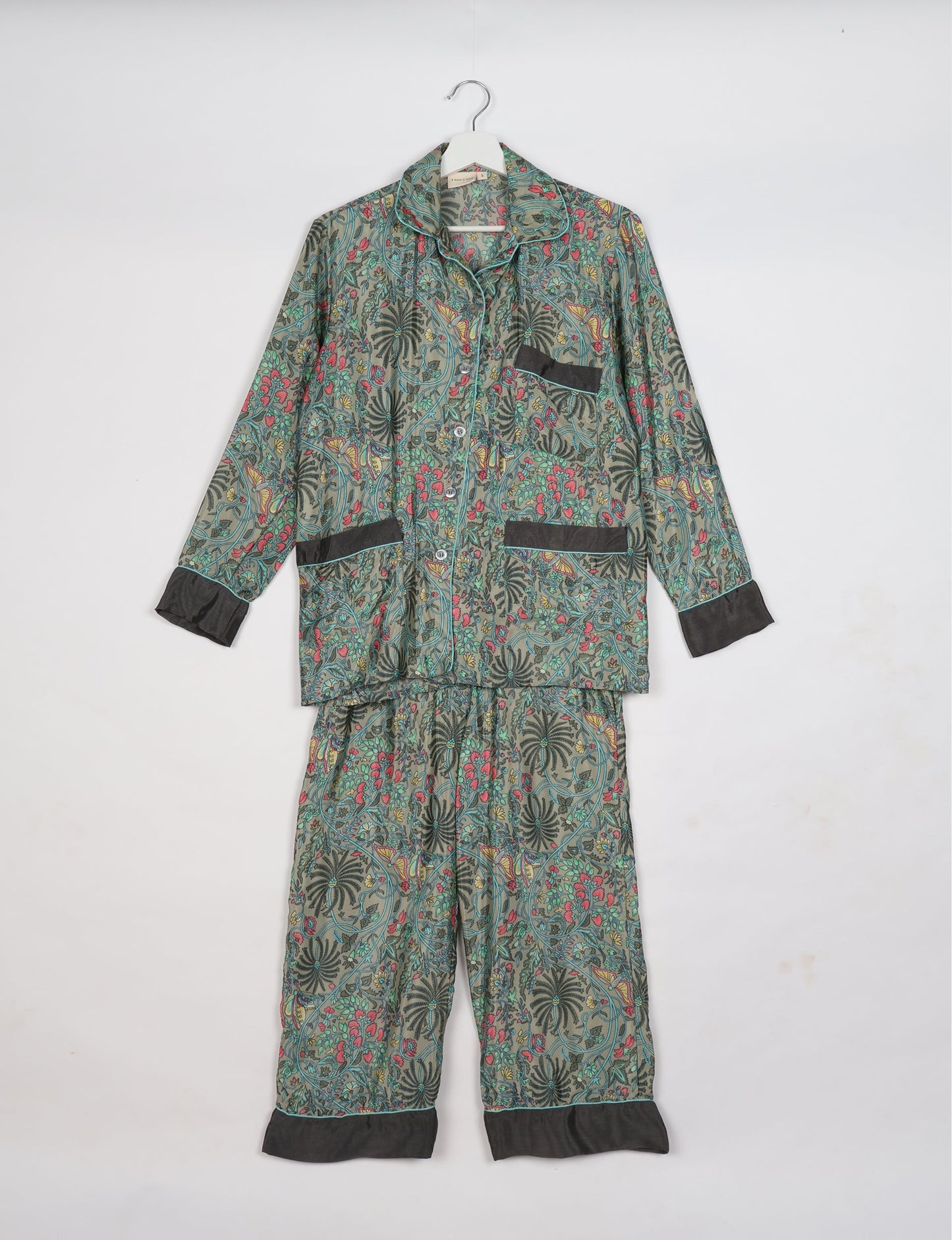 Chic long-sleeve pajama set made from recycled materials, representing eco friendly products, repurposed clothing, and zero waste clothing in green fashion.