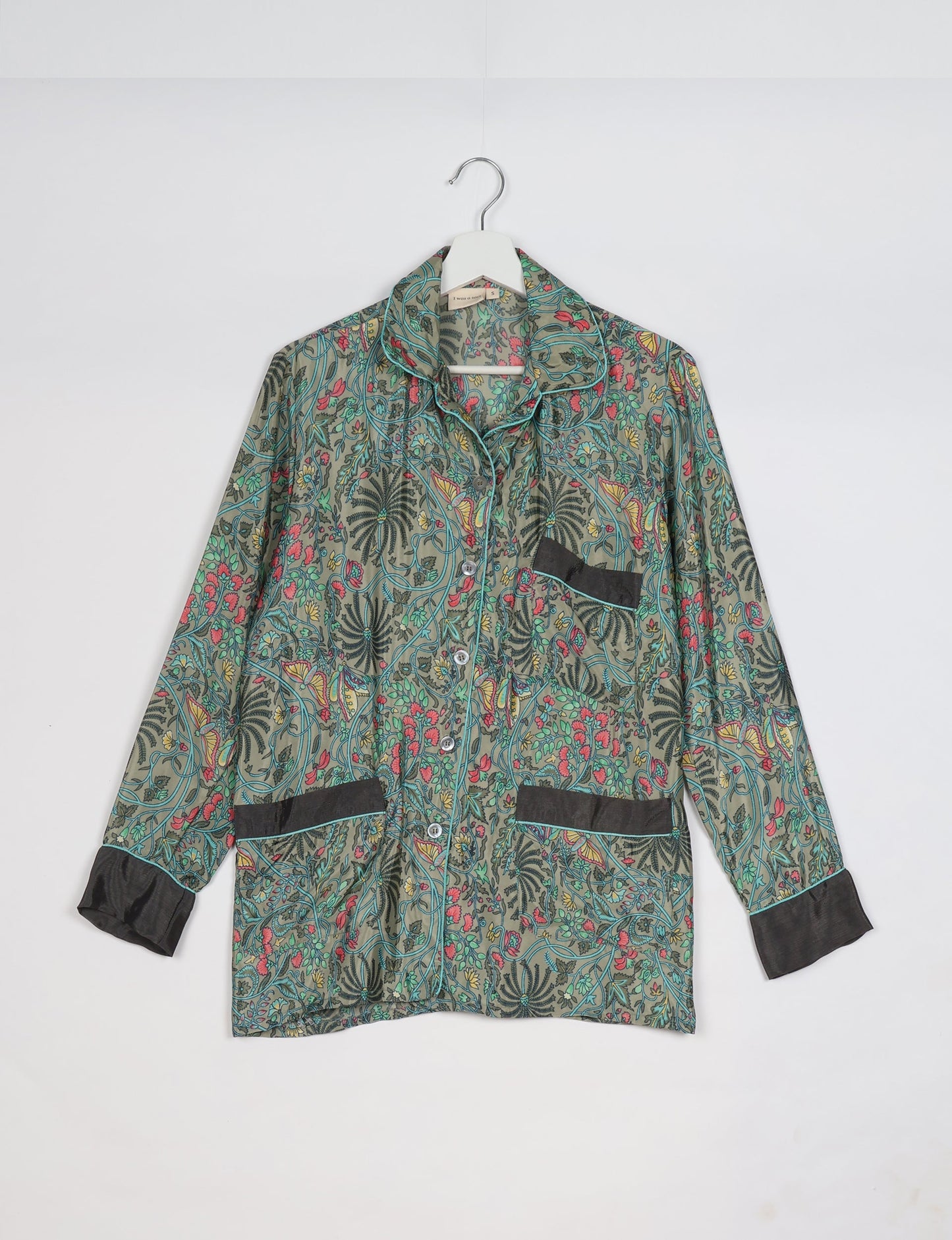 Chic long-sleeve pajama set made from recycled materials, representing eco friendly products, repurposed clothing, and zero waste clothing in green fashion.