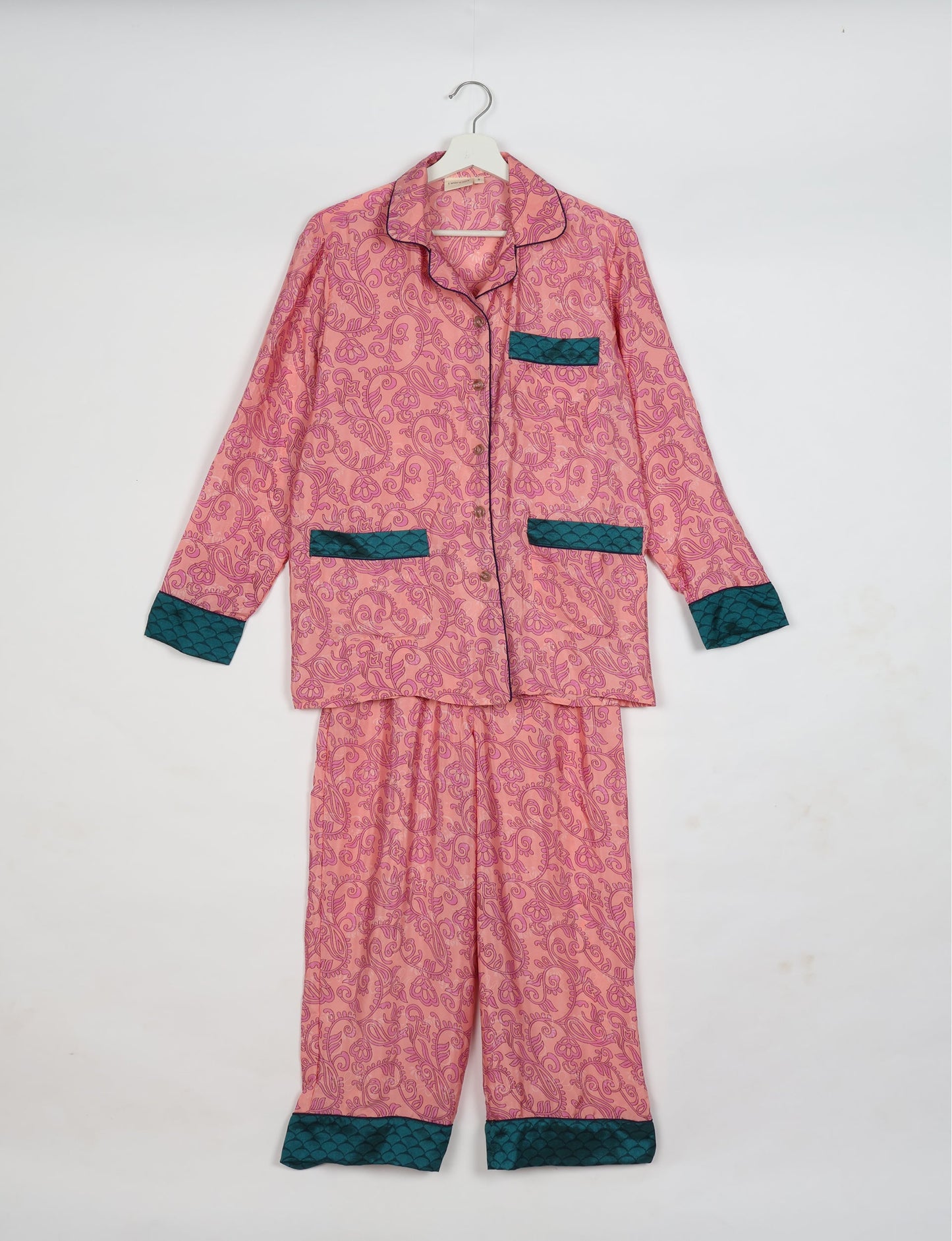 Chic long-sleeve pajama set made from recycled materials, representing eco friendly products, repurposed clothing, and zero waste clothing in green fashion.