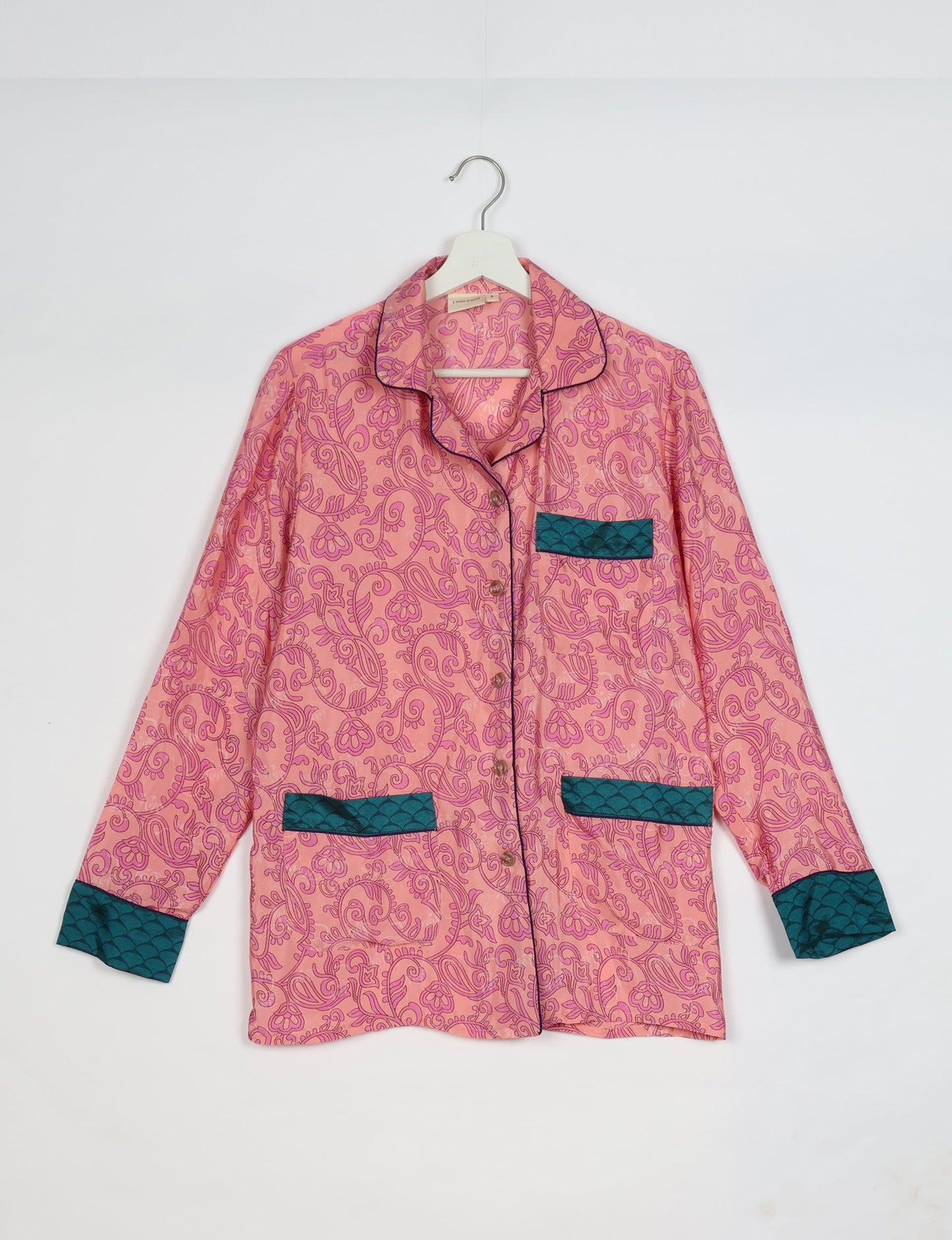 Chic long-sleeve pajama set made from recycled materials, representing eco friendly products, repurposed clothing, and zero waste clothing in green fashion.