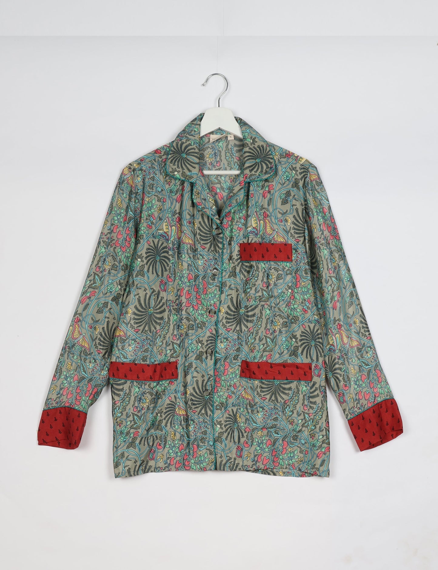 Chic long-sleeve pajama set made from recycled materials, representing eco friendly products, repurposed clothing, and zero waste clothing in green fashion.