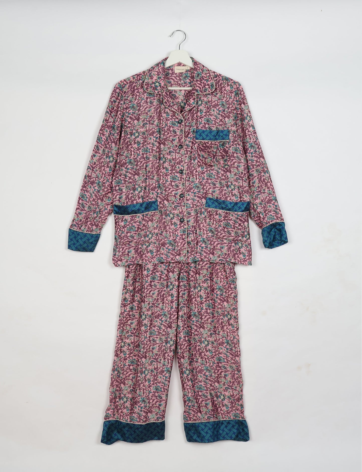 Chic long-sleeve pajama set made from recycled materials, representing eco friendly products, repurposed clothing, and zero waste clothing in green fashion.