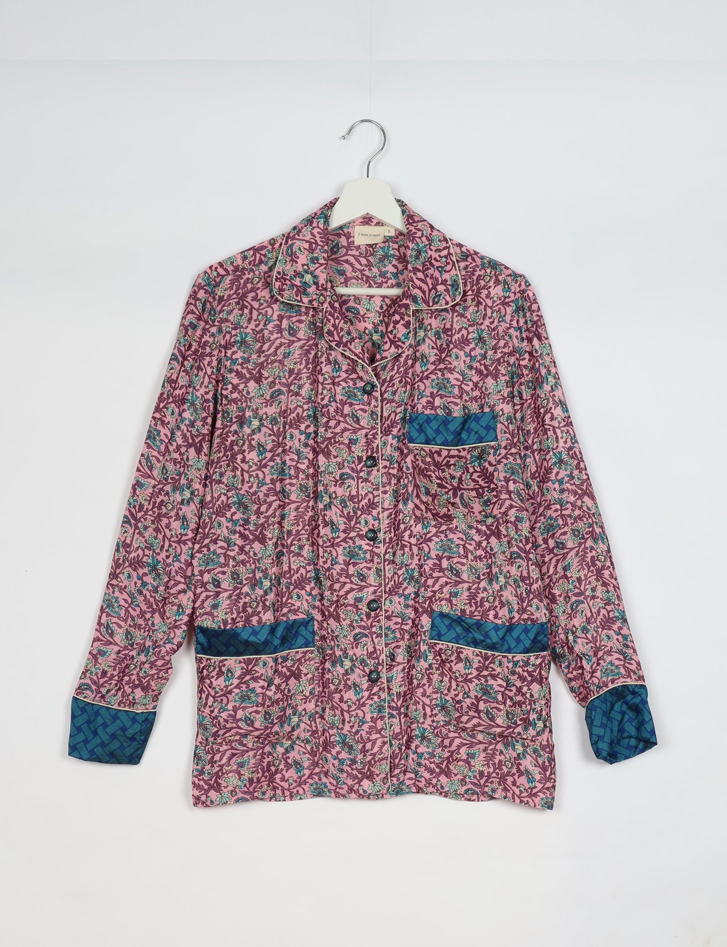 Chic long-sleeve pajama set made from recycled materials, representing eco friendly products, repurposed clothing, and zero waste clothing in green fashion.