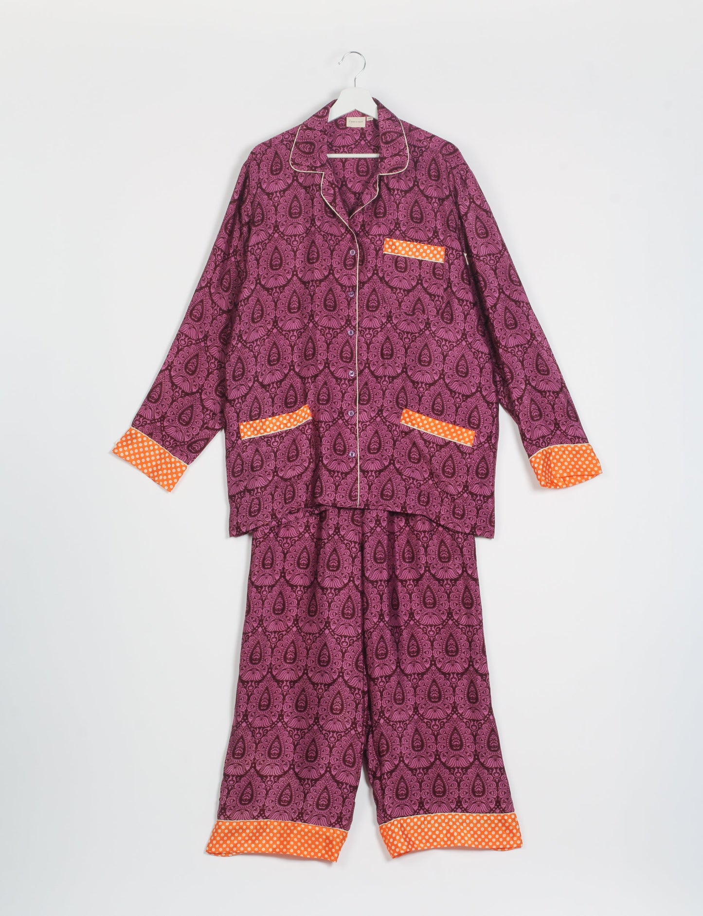 Choose sustainable sleepwear with our PJ SET – perfect for conscious living. From chilling to entertaining, these day-to-night pajamas feature an ethically crafted long-sleeve button-down and elastic-waist pants. Elevate your sleepwear with eco-friendly elegance.