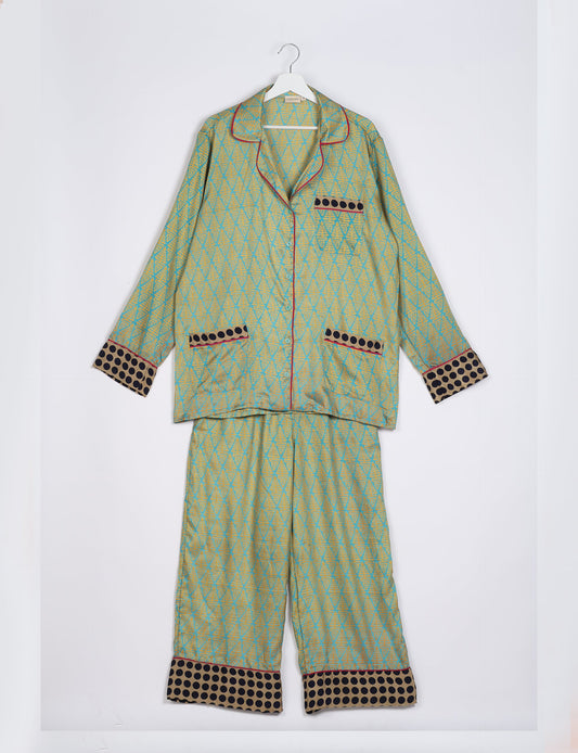 Choose sustainable sleepwear with our PJ SET – perfect for conscious living. From chilling to entertaining, these day-to-night pajamas feature an ethically crafted long-sleeve button-down and elastic-waist pants. Elevate your sleepwear with eco-friendly elegance.