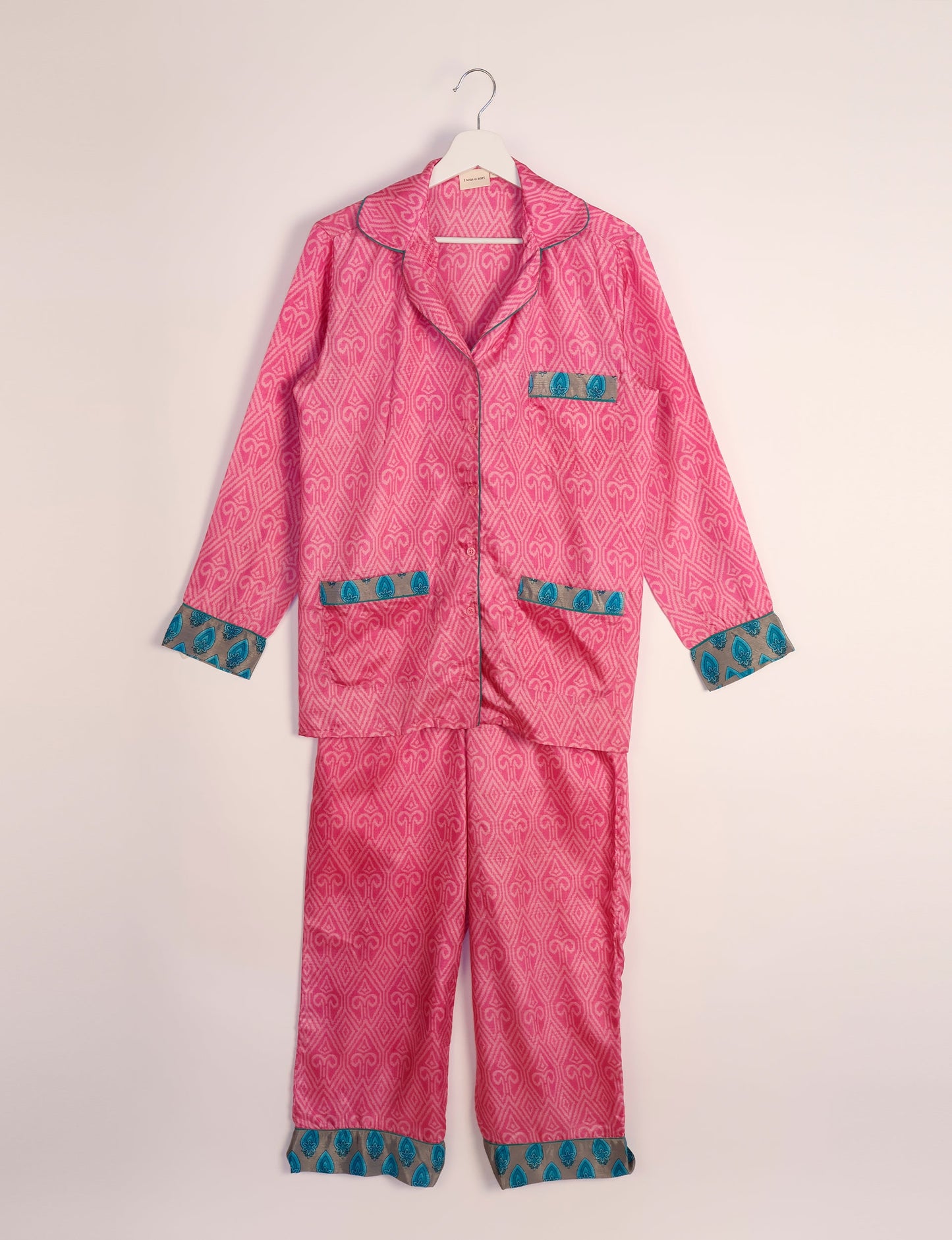 Choose sustainable sleepwear with our PJ SET – perfect for conscious living. From chilling to entertaining, these day-to-night pajamas feature an ethically crafted long-sleeve button-down and elastic-waist pants. Elevate your sleepwear with eco-friendly elegance.