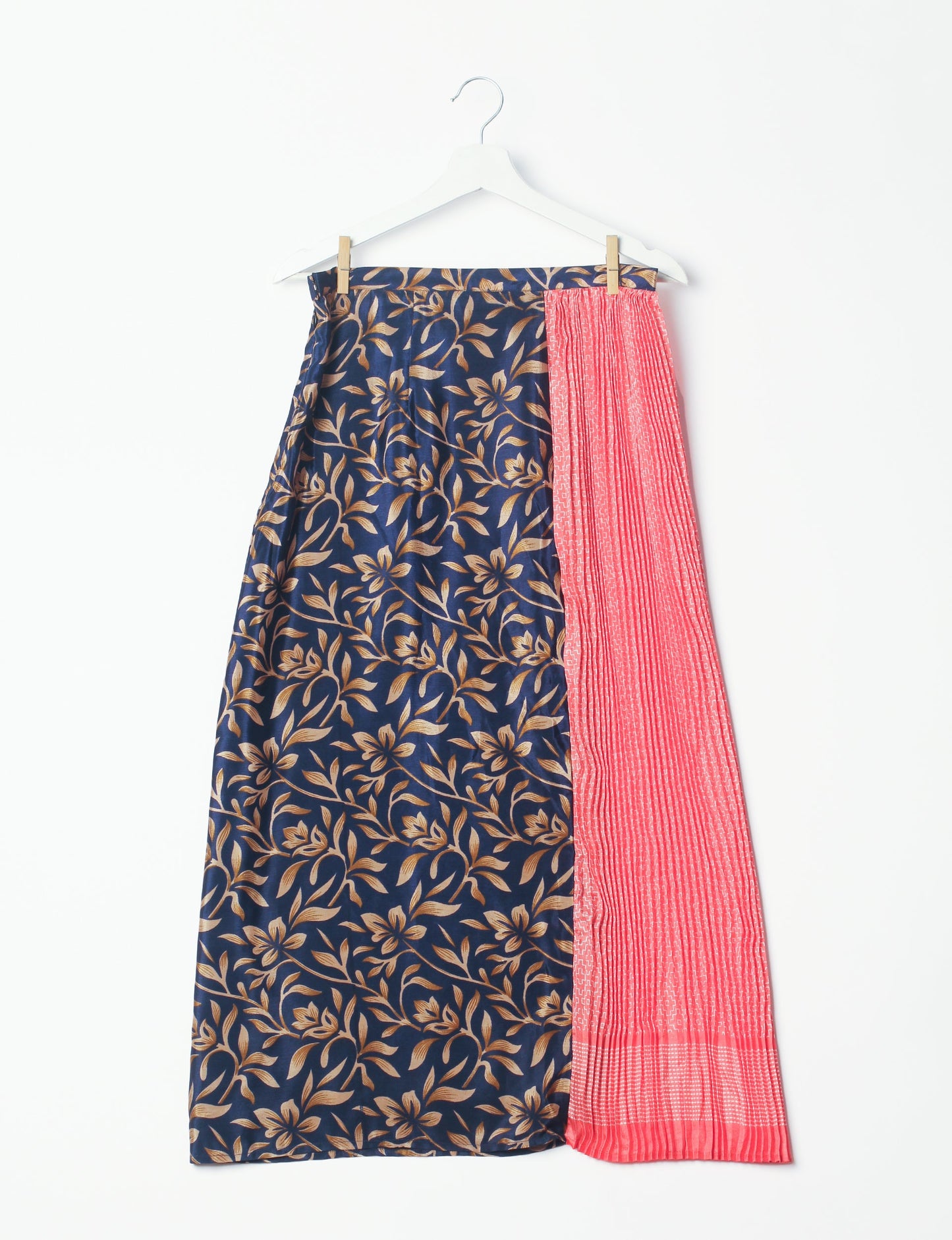 Elevate your wardrobe with the Semi Pleated A-Line Skirt, a sustainable fashion statement. Unique prints, a mix of fabrics, and intricate knife pleats create an individualized, upscale day-to-night look. Crafted with ethical and green fashion values, this skirt represents the essence of eco-friendly style.