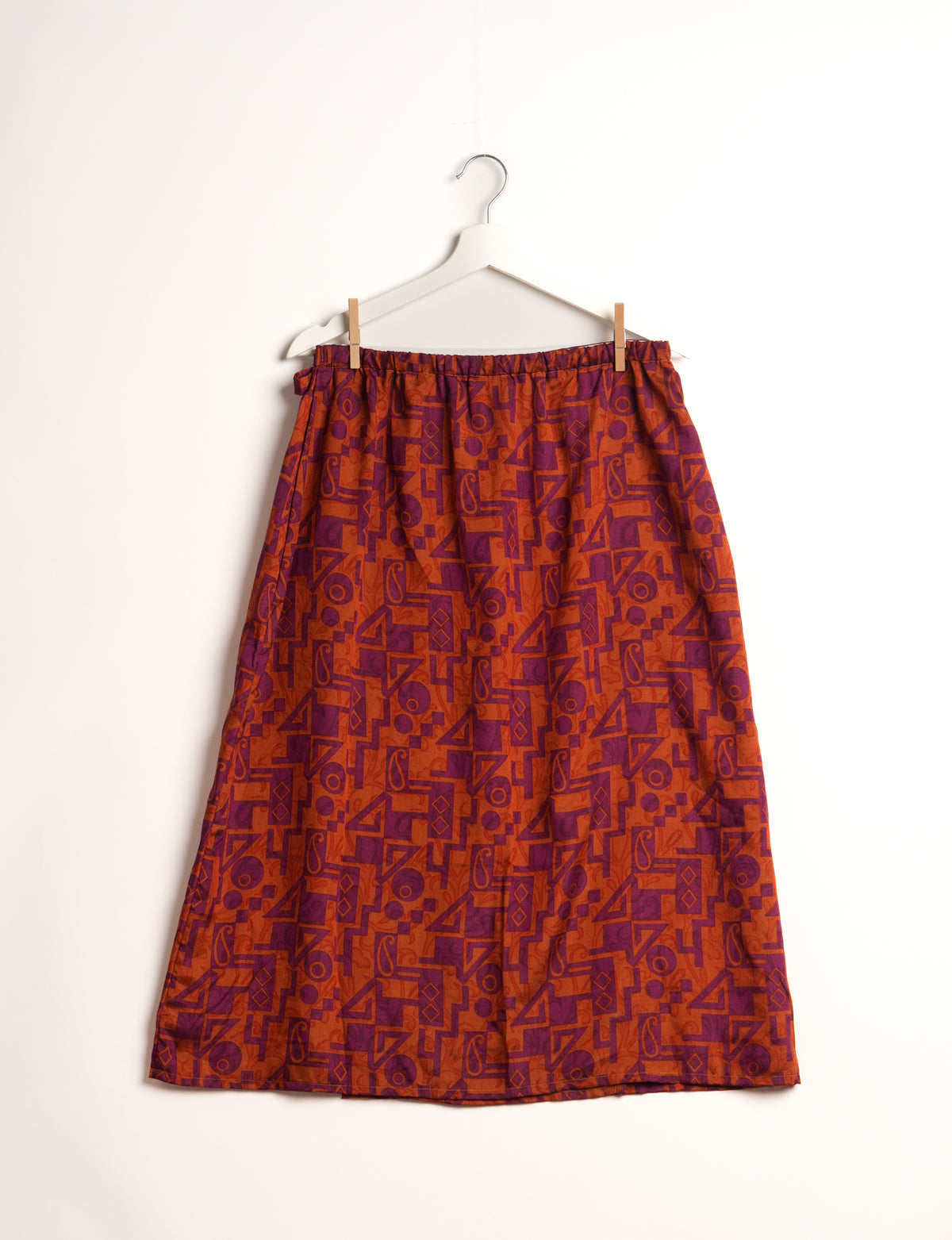 Versatile and sustainable LONG WRAPAROUND SKIRT, mid-calf length, defying convention and suitable for all waist sizes. Elevate your style with this eco-friendly and comfortable piece, creating a unique and inclusive fashion experience.