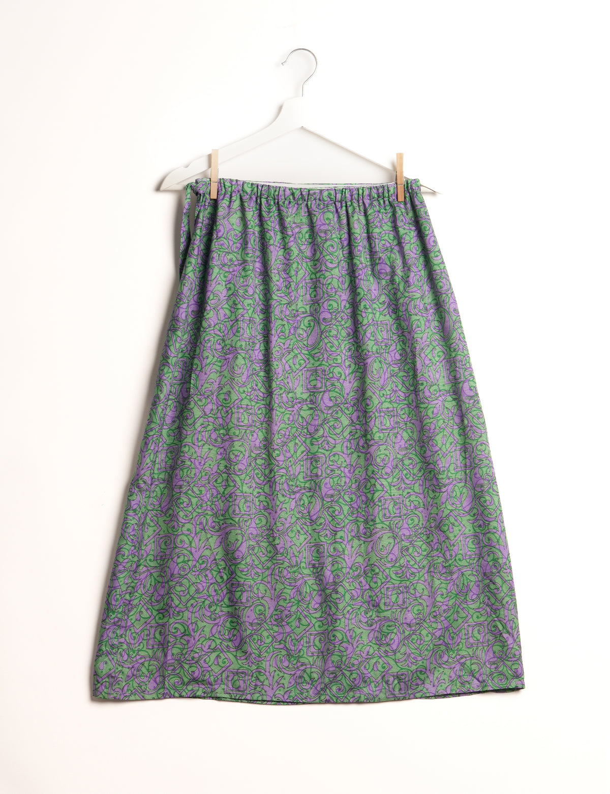 Versatile and sustainable LONG WRAPAROUND SKIRT, mid-calf length, defying convention and suitable for all waist sizes. Elevate your style with this eco-friendly and comfortable piece, creating a unique and inclusive fashion experience.