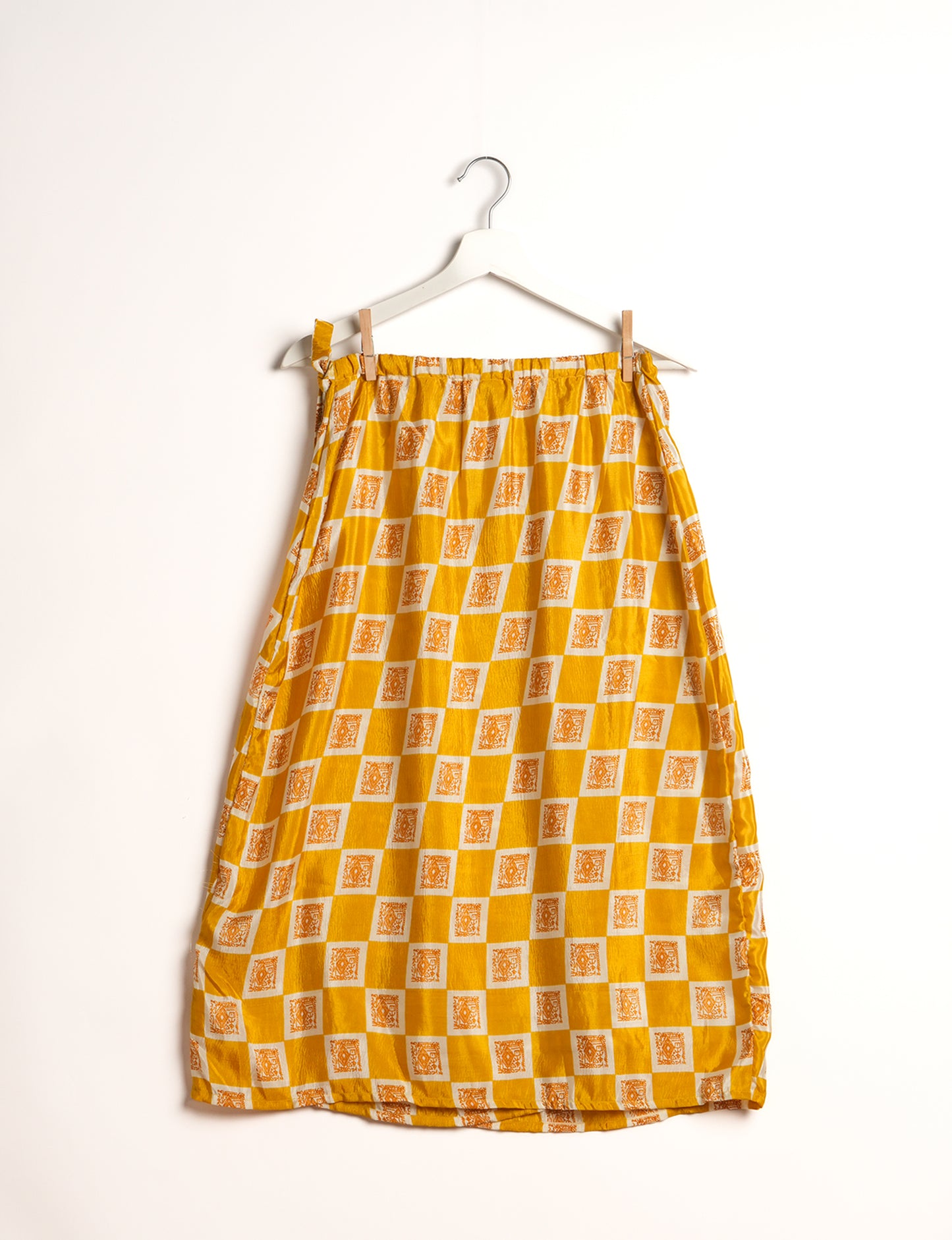 Versatile and sustainable LONG WRAPAROUND SKIRT, mid-calf length, defying convention and suitable for all waist sizes. Elevate your style with this eco-friendly and comfortable piece, creating a unique and inclusive fashion experience.