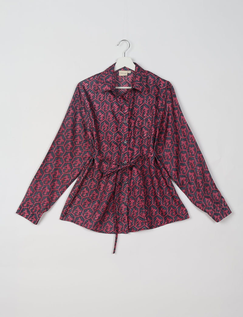 Pink and dark blue Indian ethnic patterned long-sleeve shirt with collar and front buttons, hanging on white hanger