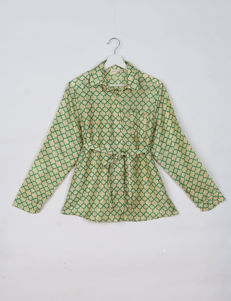 Long-sleeve shirt with green and beige geometric pattern, button front, collar, and waist tie, hanging on white hanger