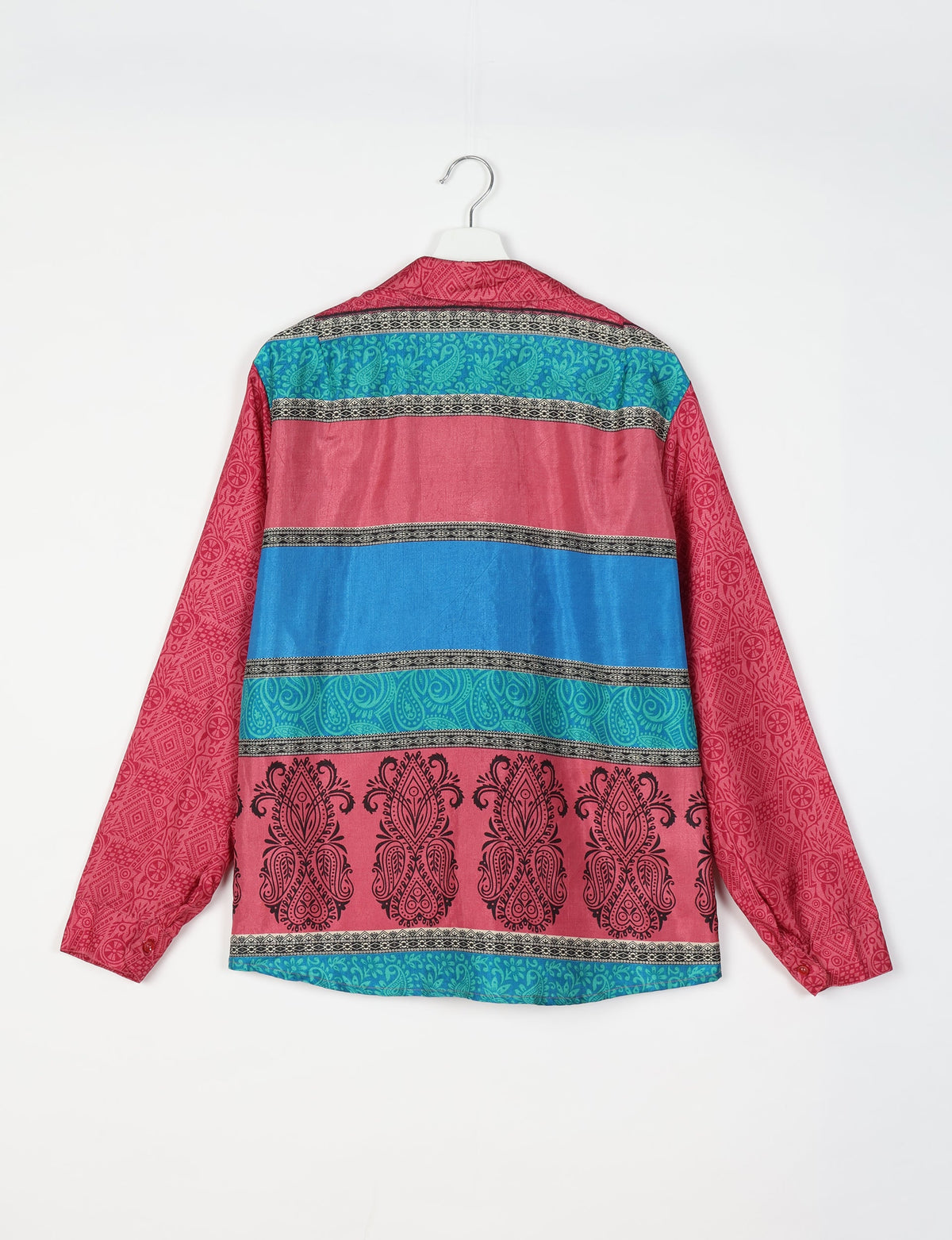 Long-sleeve shirt with pink, blue, and turquoise horizontal stripes and black paisley and geometric patterns, back view on hanger