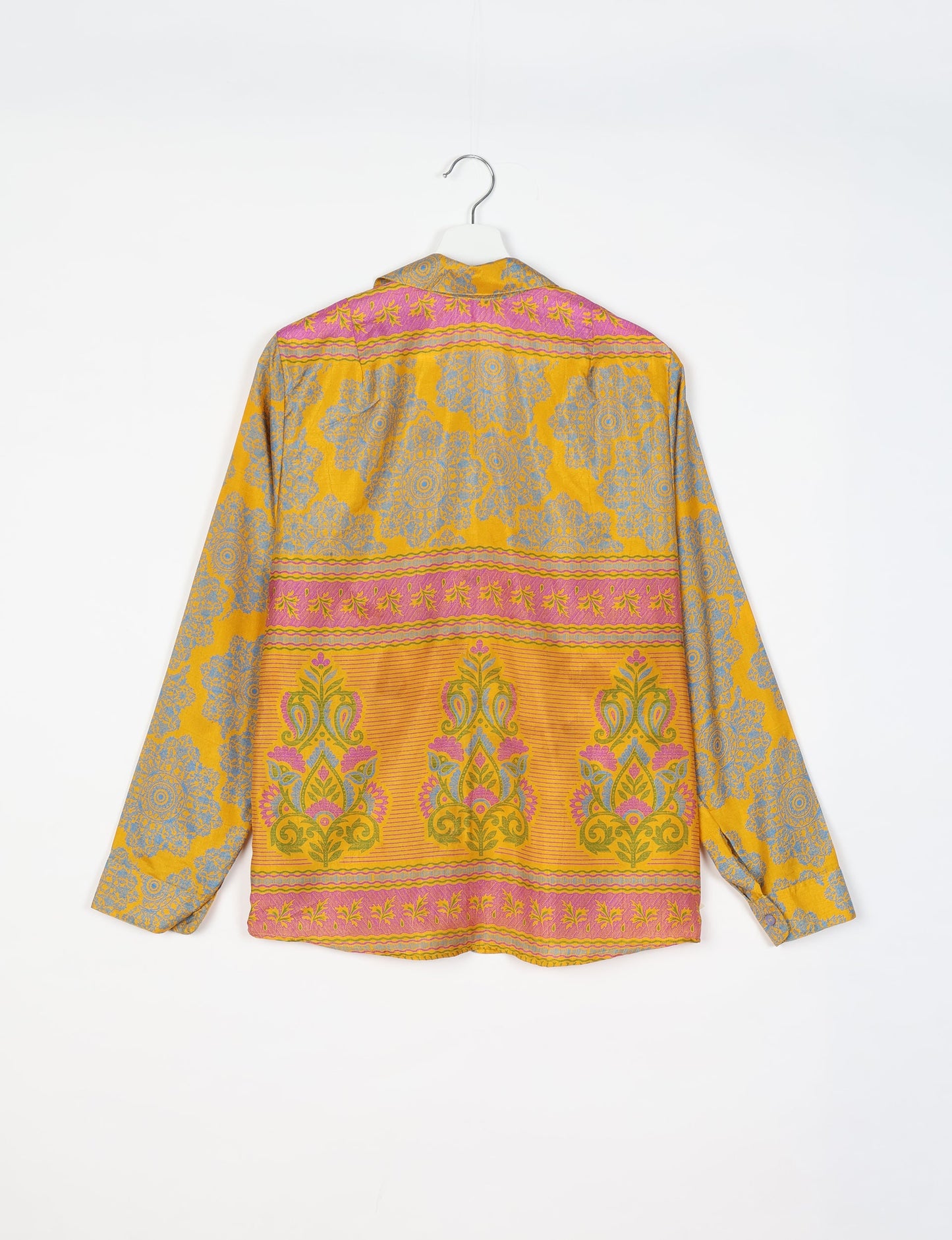 Experience sustainable fashion with our classic slim-fit shirt, crafted with ethical and green values. The shirt, designed for minimal waste, features a tie-up waist belt or neck tie, semi-spread collar, and regular shirt cuffs. Versatile and eco-friendly, wear it tucked in, unbuttoned over a tank top, or knotted at the waist for a unique style.