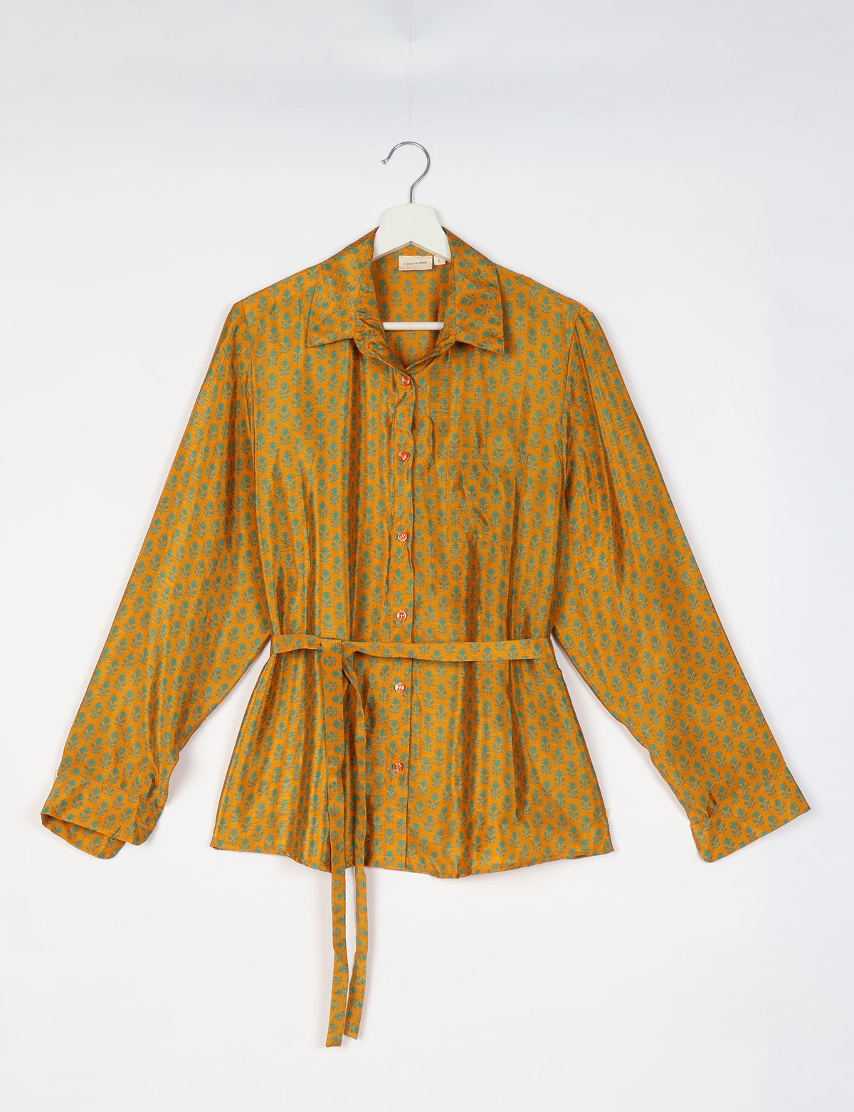 Yellow button-up shirt with green micro floral pattern, long sleeves, collar, and waist tie, shown on hanger front view