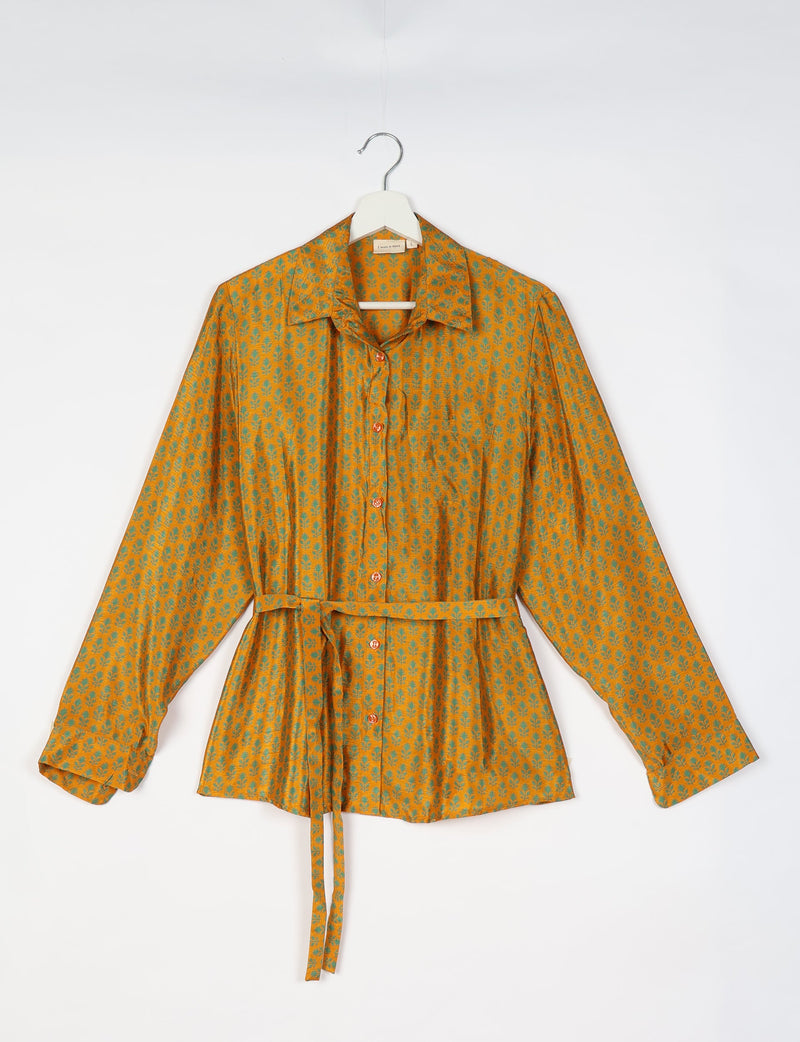 Yellow button-up shirt with green micro floral pattern, long sleeves, collar, and waist tie, shown on hanger front view