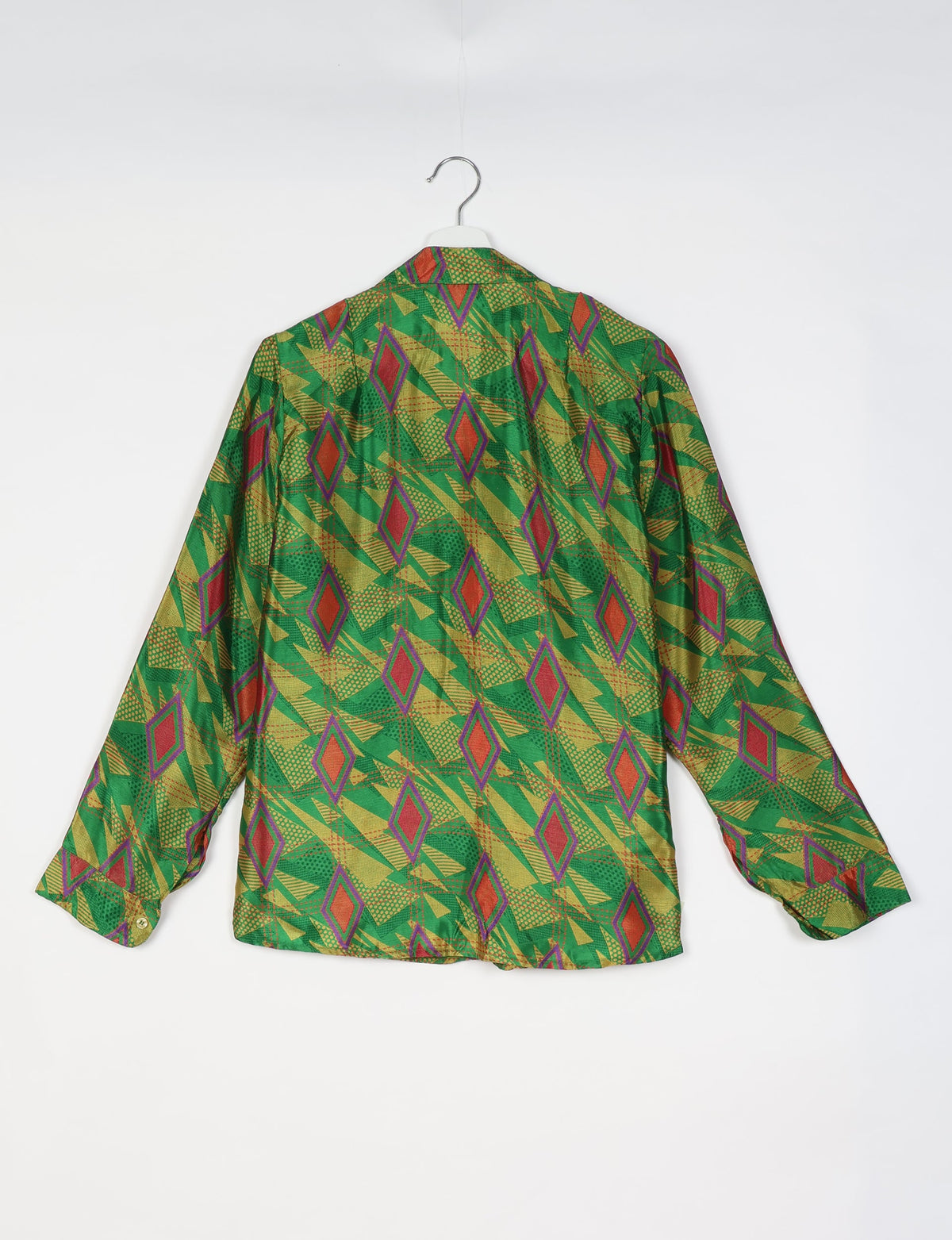 Green long-sleeve shirt with red and yellow geometric diamond pattern, shown from back on white hanger against white background