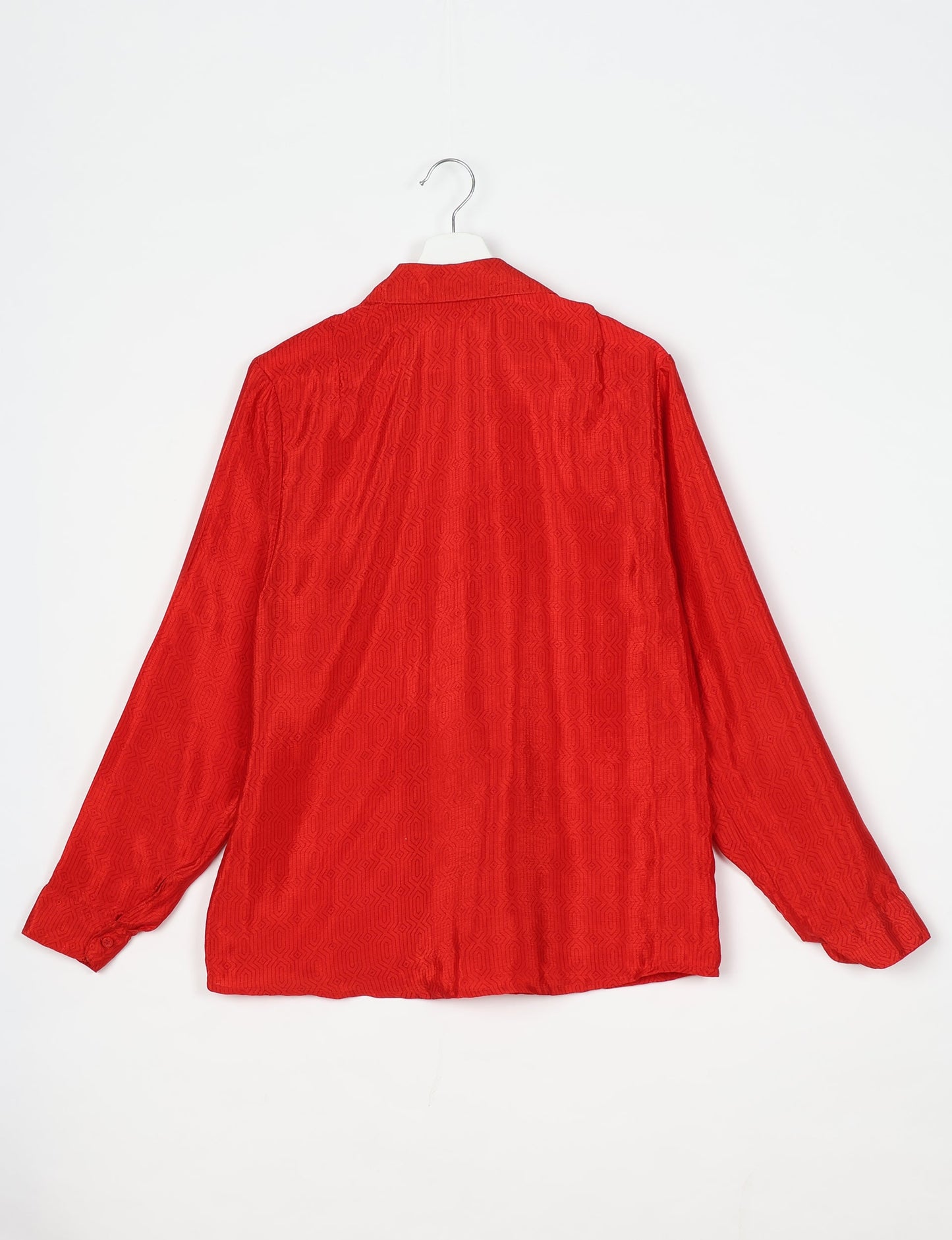 Experience sustainable fashion with our classic slim-fit shirt, crafted with ethical and green values. The shirt, designed for minimal waste, features a tie-up waist belt or neck tie, semi-spread collar, and regular shirt cuffs. Versatile and eco-friendly, wear it tucked in, unbuttoned over a tank top, or knotted at the waist for a unique style.