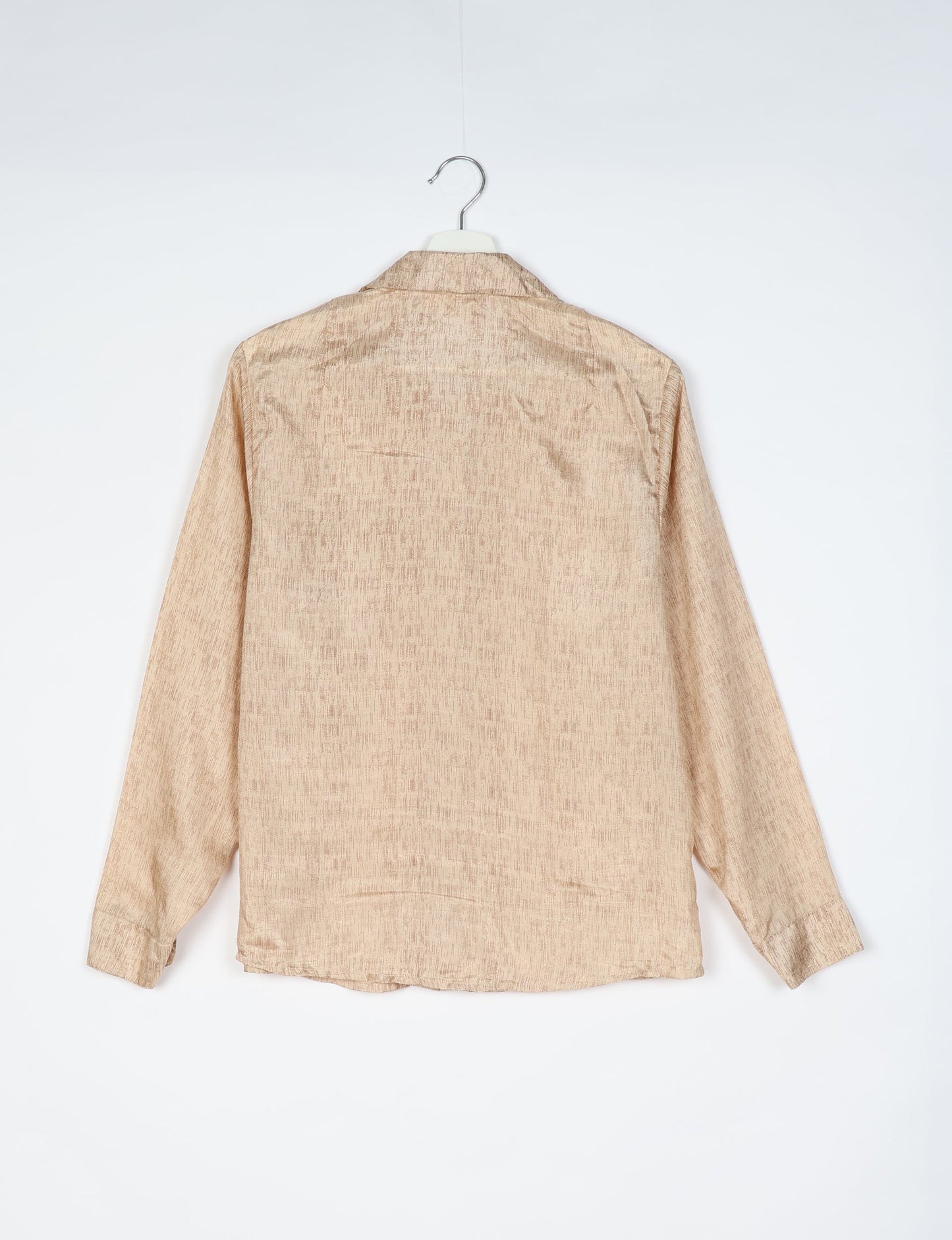 Experience sustainable fashion with our classic slim-fit shirt, crafted with ethical and green values. The shirt, designed for minimal waste, features a tie-up waist belt or neck tie, semi-spread collar, and regular shirt cuffs. Versatile and eco-friendly, wear it tucked in, unbuttoned over a tank top, or knotted at the waist for a unique style.