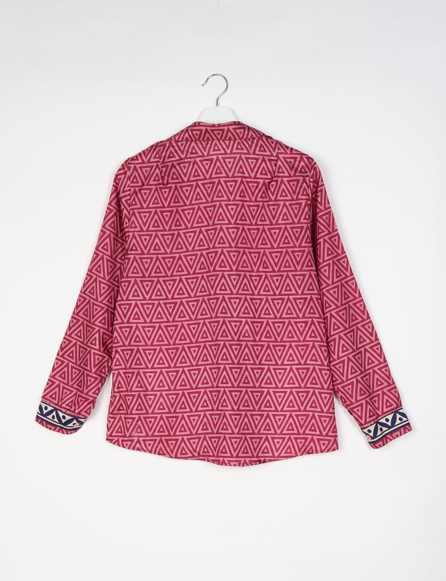 Experience sustainable fashion with our classic slim-fit shirt, crafted with ethical and green values. The shirt, designed for minimal waste, features a tie-up waist belt or neck tie, semi-spread collar, and regular shirt cuffs. Versatile and eco-friendly, wear it tucked in, unbuttoned over a tank top, or knotted at the waist for a unique style.