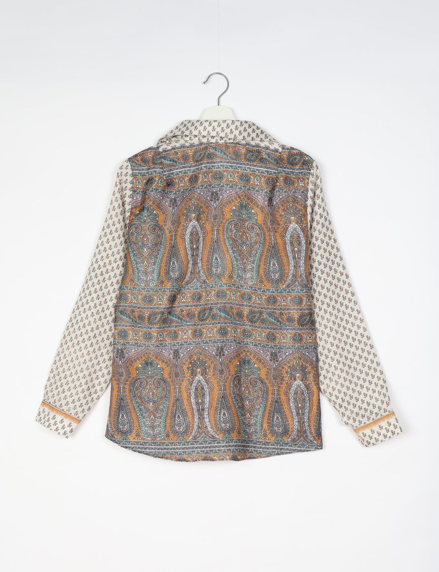 Experience sustainable fashion with our classic slim-fit shirt, crafted with ethical and green values. The shirt, designed for minimal waste, features a tie-up waist belt or neck tie, semi-spread collar, and regular shirt cuffs. Versatile and eco-friendly, wear it tucked in, unbuttoned over a tank top, or knotted at the waist for a unique style.