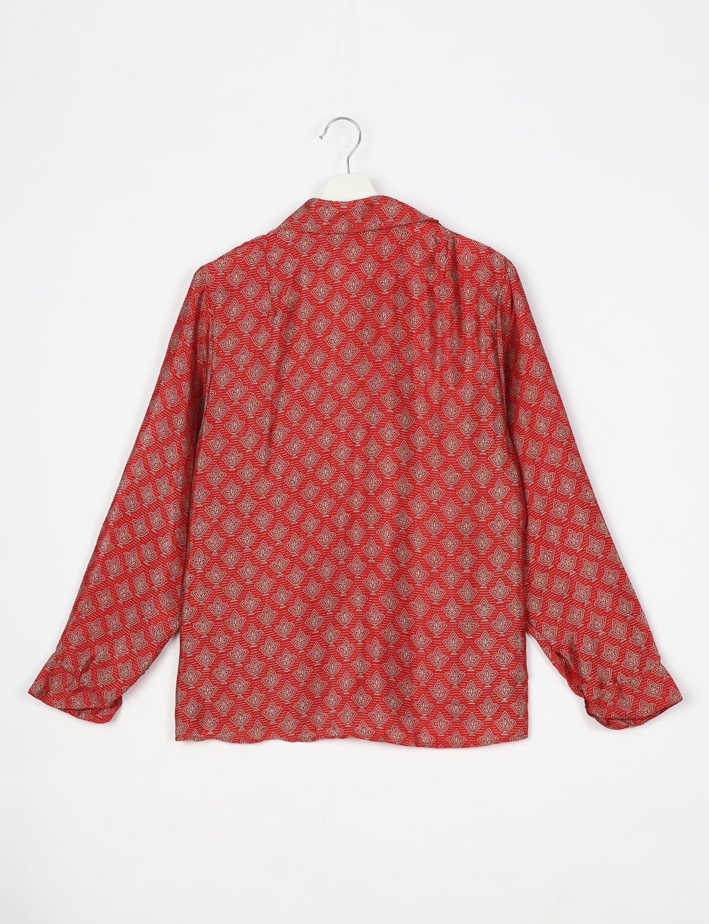 Experience sustainable fashion with our classic slim-fit shirt, crafted with ethical and green values. The shirt, designed for minimal waste, features a tie-up waist belt or neck tie, semi-spread collar, and regular shirt cuffs. Versatile and eco-friendly, wear it tucked in, unbuttoned over a tank top, or knotted at the waist for a unique style.