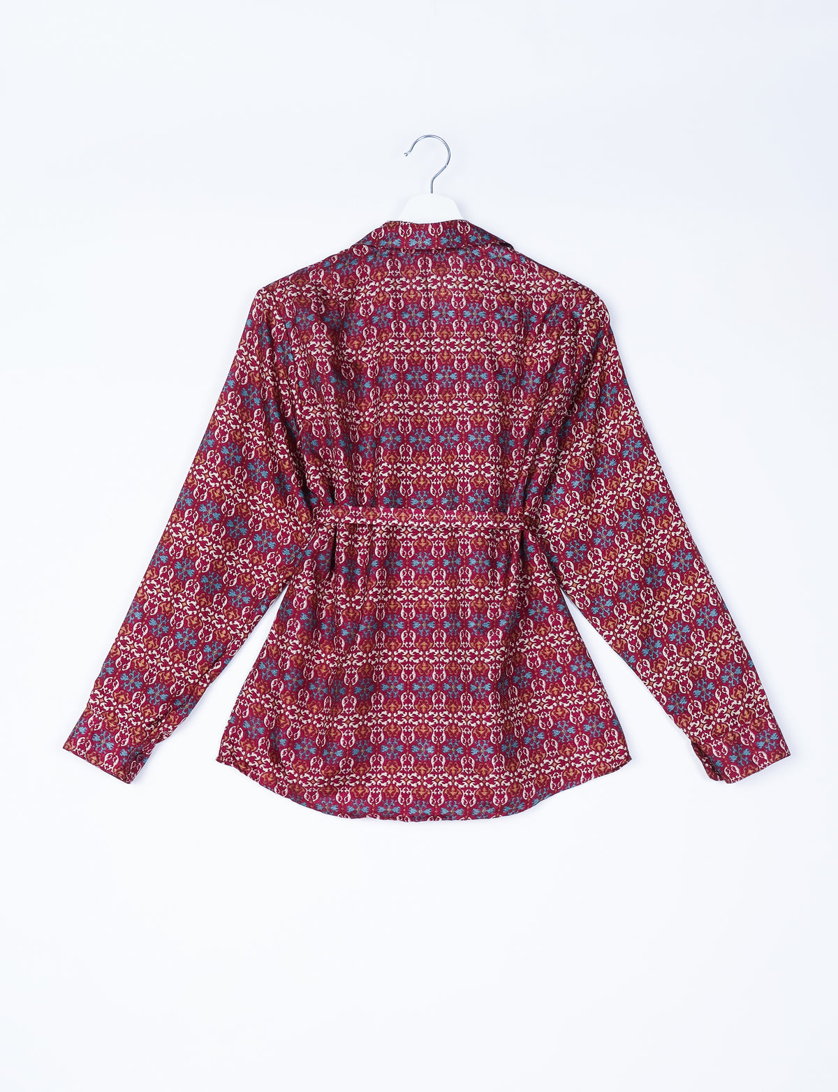 Brown Indian ethnic shirt with red, blue, and white intricate pattern, long sleeves, and back view on white hanger
